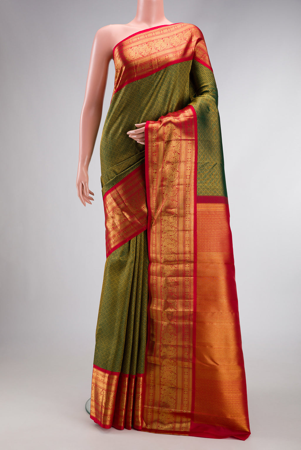 Green Dual Tone Kanchipuram Silk Saree with Zari Brocade on the body and Zari Border.  displayed on a mannequin