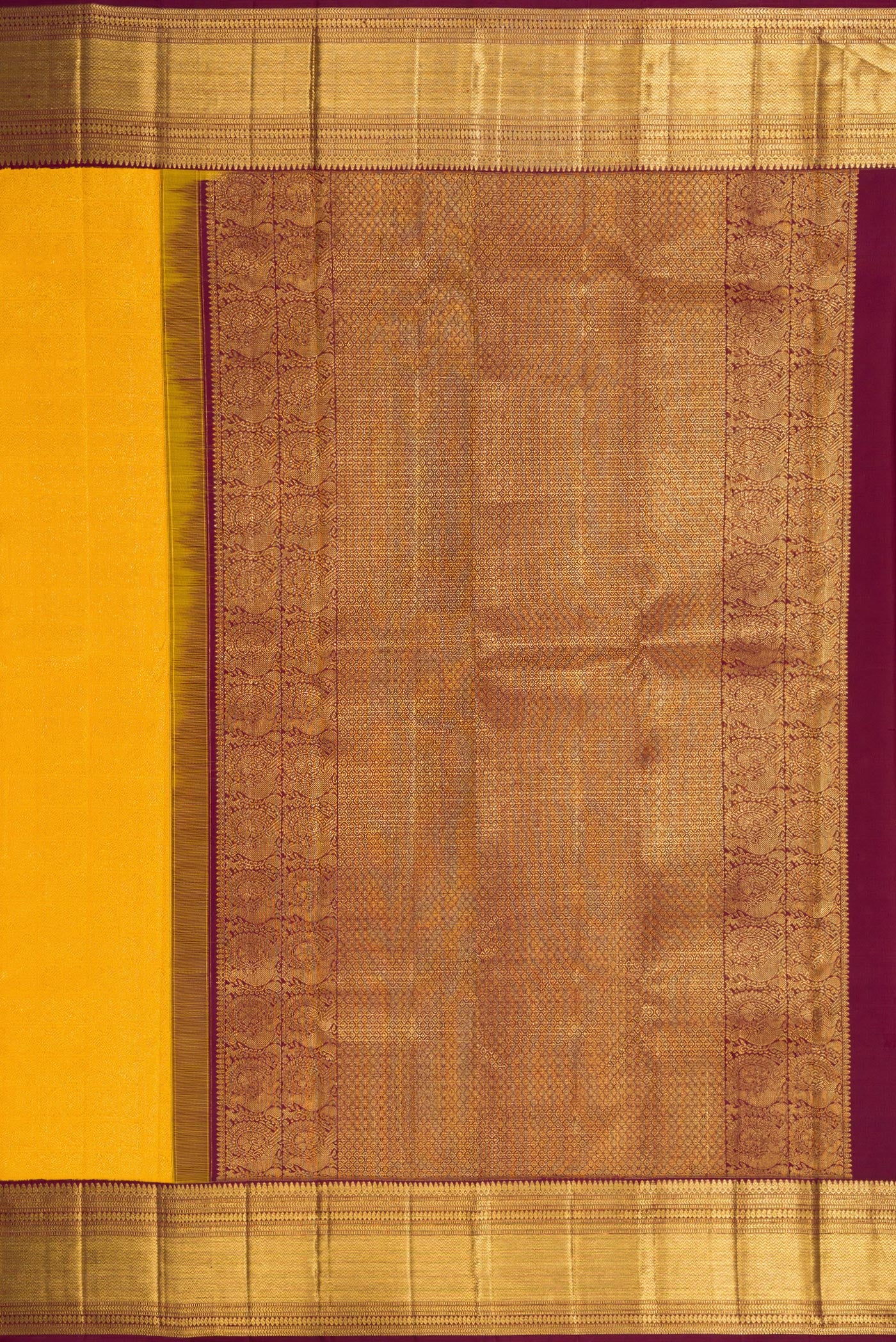 Close up image of the pallu of Yellow Dual Tone Kanchipuram Silk Saree with Zari Brocade on the body and Zari Border. 