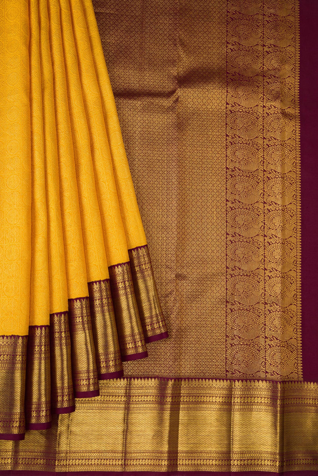 Pleats and pallu of Yellow Dual Tone Kanchipuram Silk Saree with Zari Brocade on the body and Zari Border. 