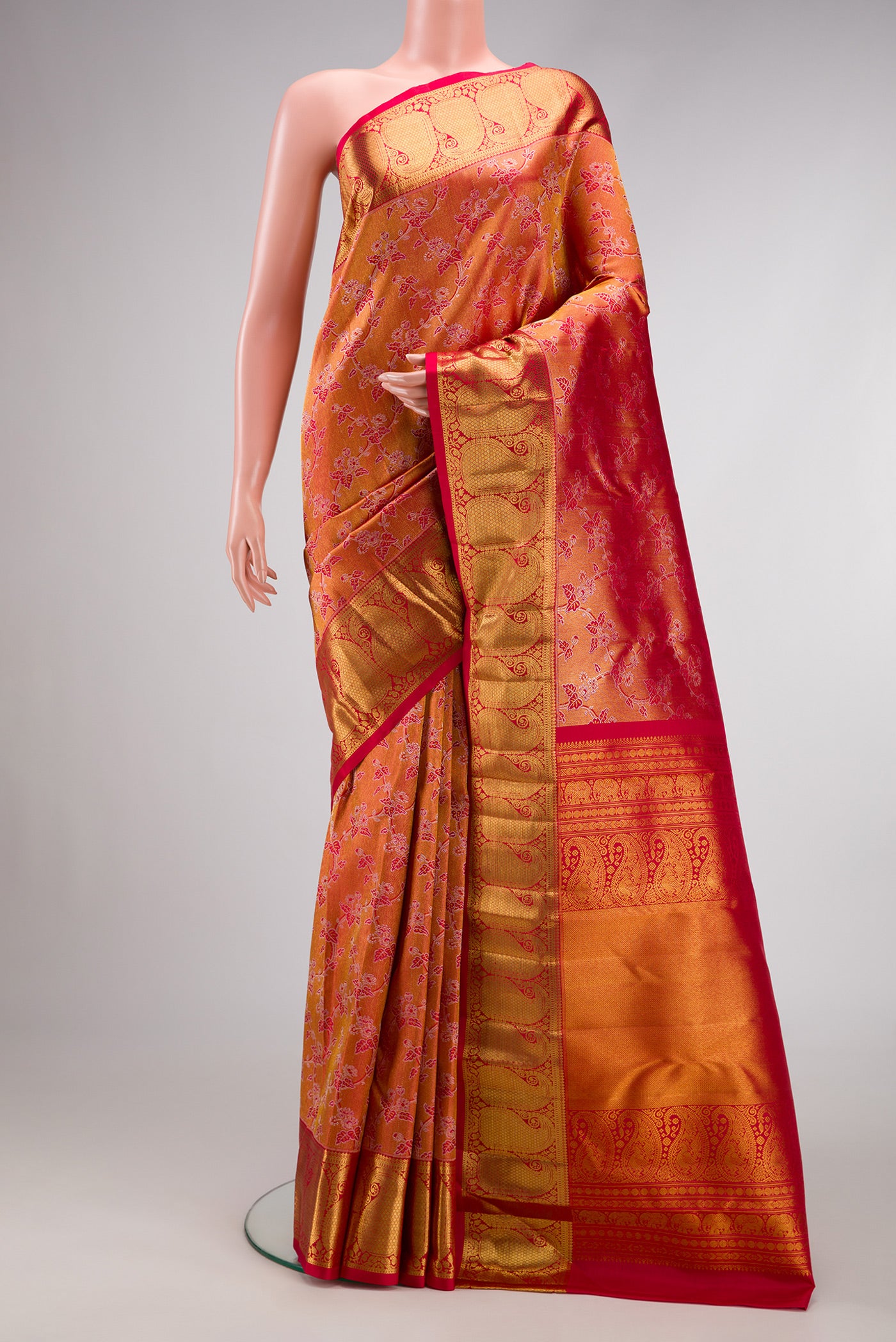 Red Dual Tone Kanchipuram Silk Saree with Zari Brocade on the body and Zari Border.  displayed on a mannequin