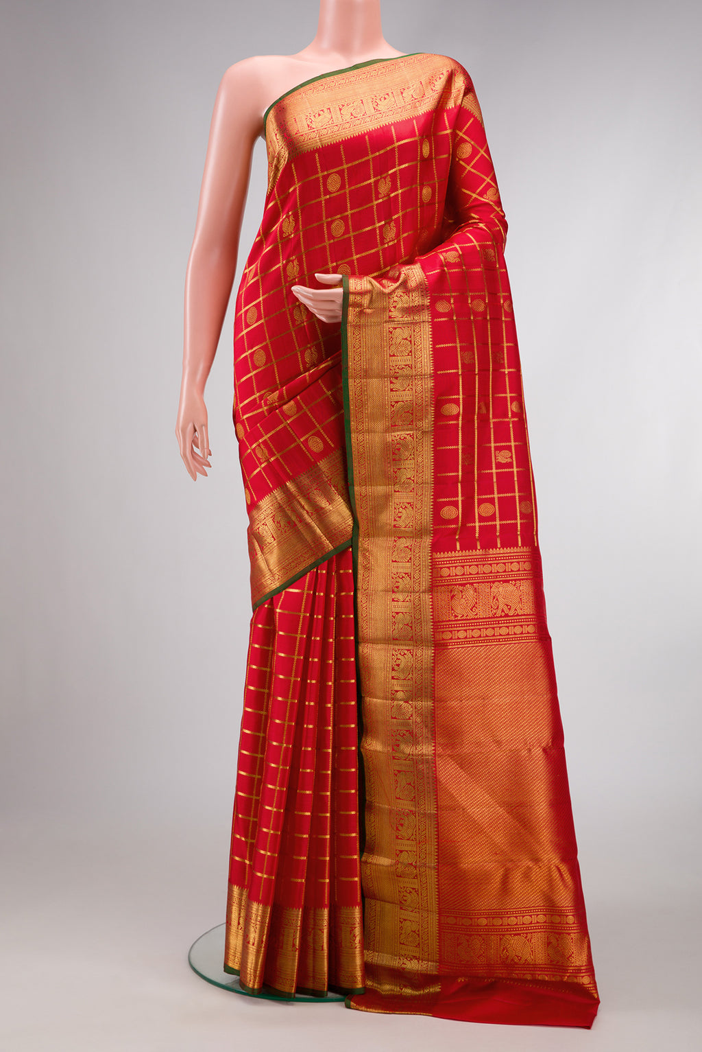 Red Dual Tone Kanchipuram Silk Saree with Checked design on the body and Zari Border.  displayed on a mannequin