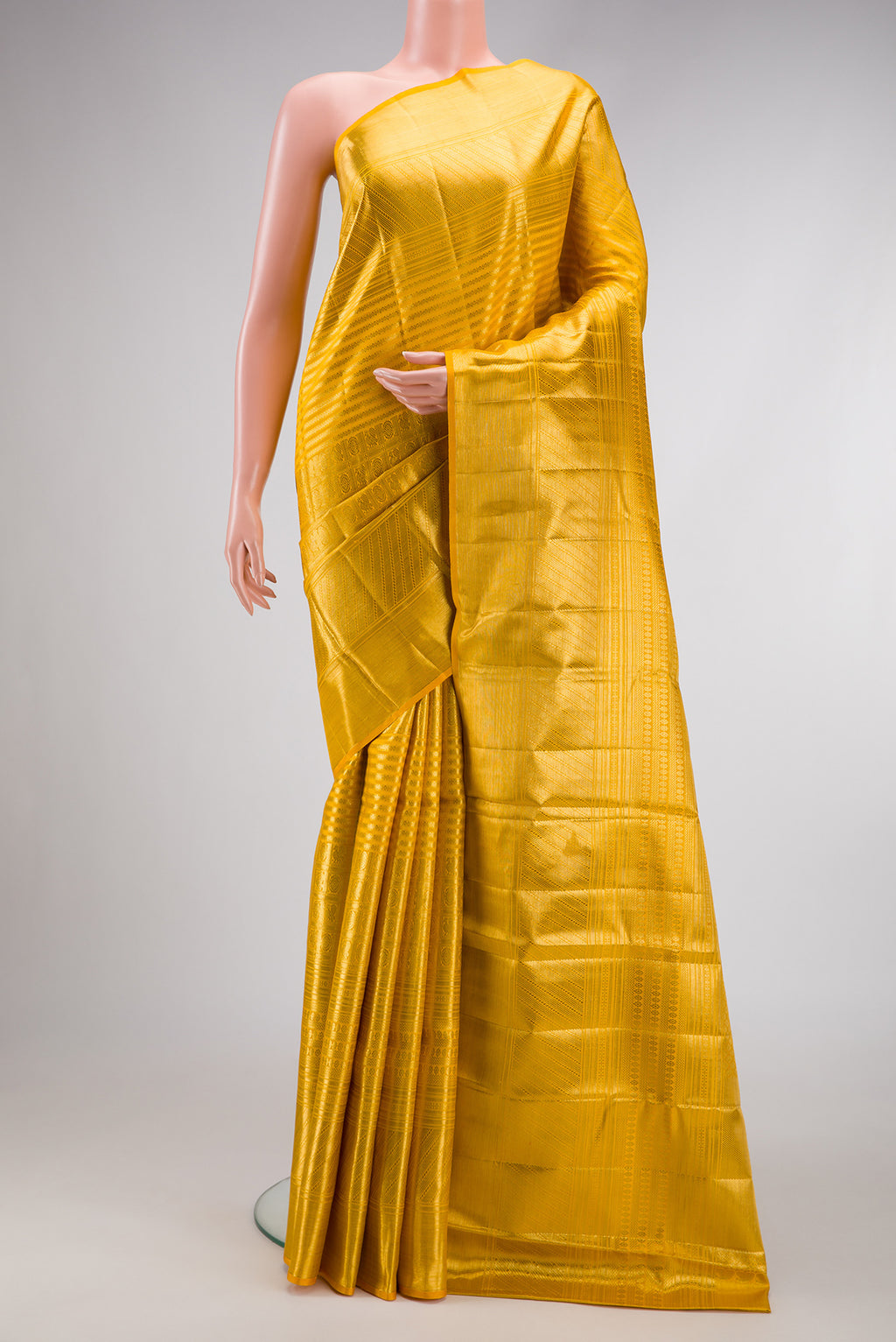 Yellow Dual Tone Kanjivaram Silk Saree with Zari Brocade on the body and Zari Border.  displayed on a mannequin