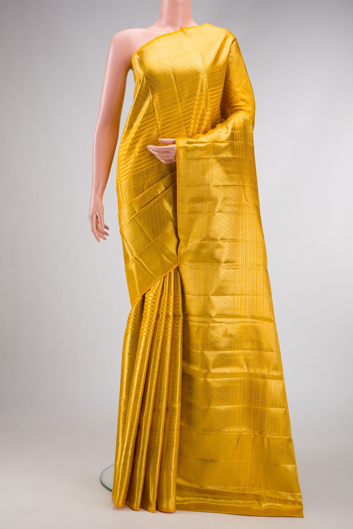 Yellow Dual Tone Kanjivaram Silk Saree with Zari Brocade on the body and Zari Border.  displayed on a mannequin