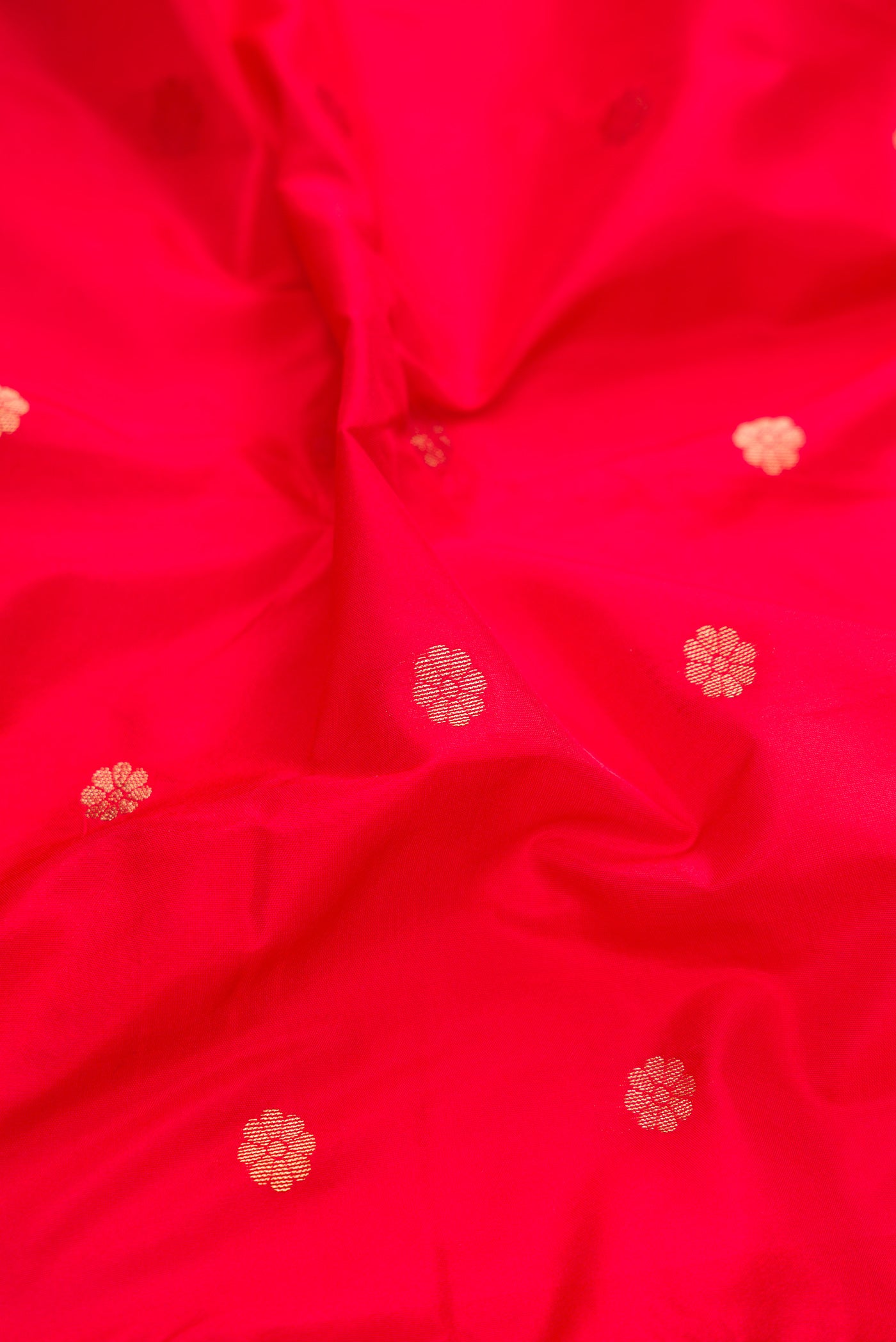 Close up of Red Dual Tone Blended Paithani Silk Saree with Zari Butta on the body and Zari Border.  displaying folds
