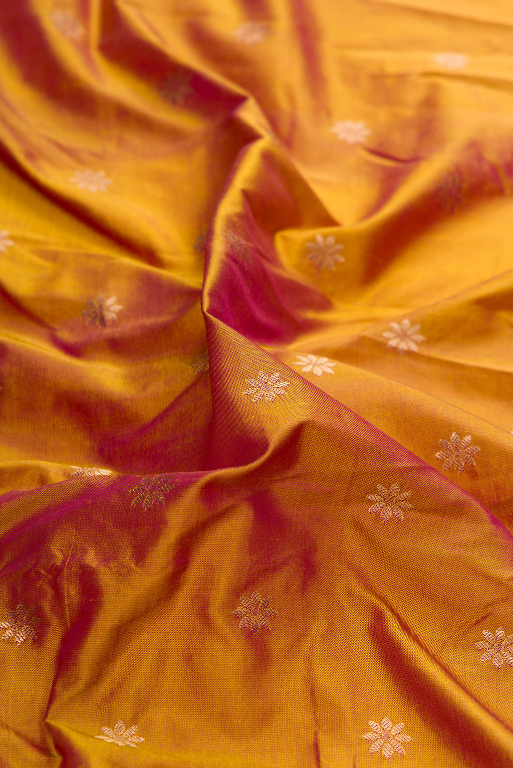 Close up of Mehandi Green Dual Tone Paithani Silk Saree with Zari Butta on the body and Paithani Border.  displaying folds