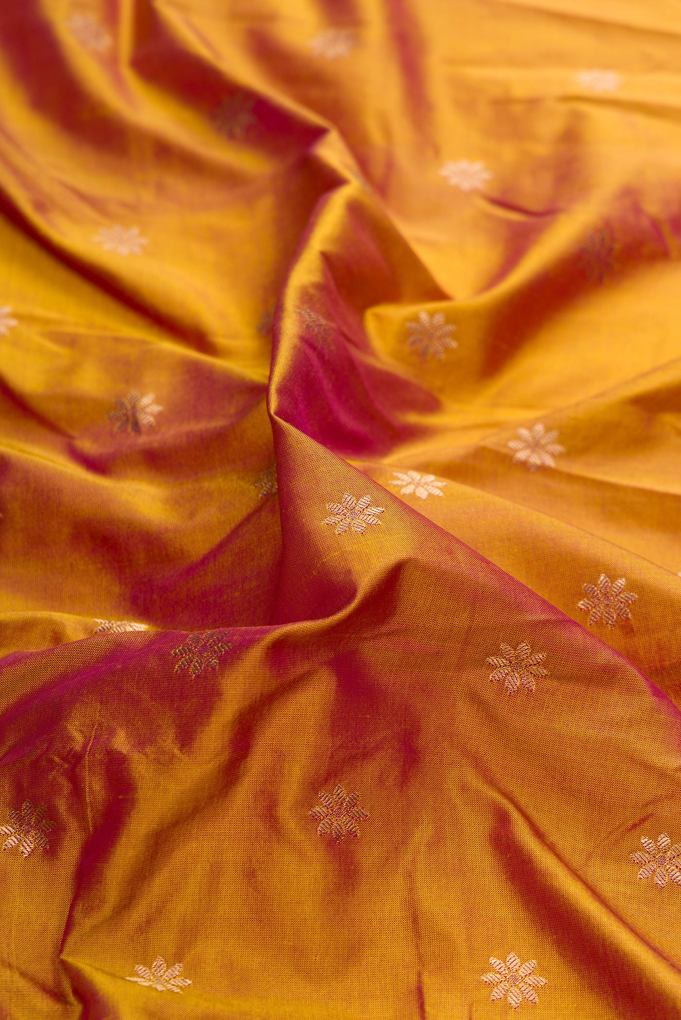 Close up of Mehandi Green Dual Tone Paithani Silk Saree with Zari Butta on the body and Paithani Border.  displaying folds