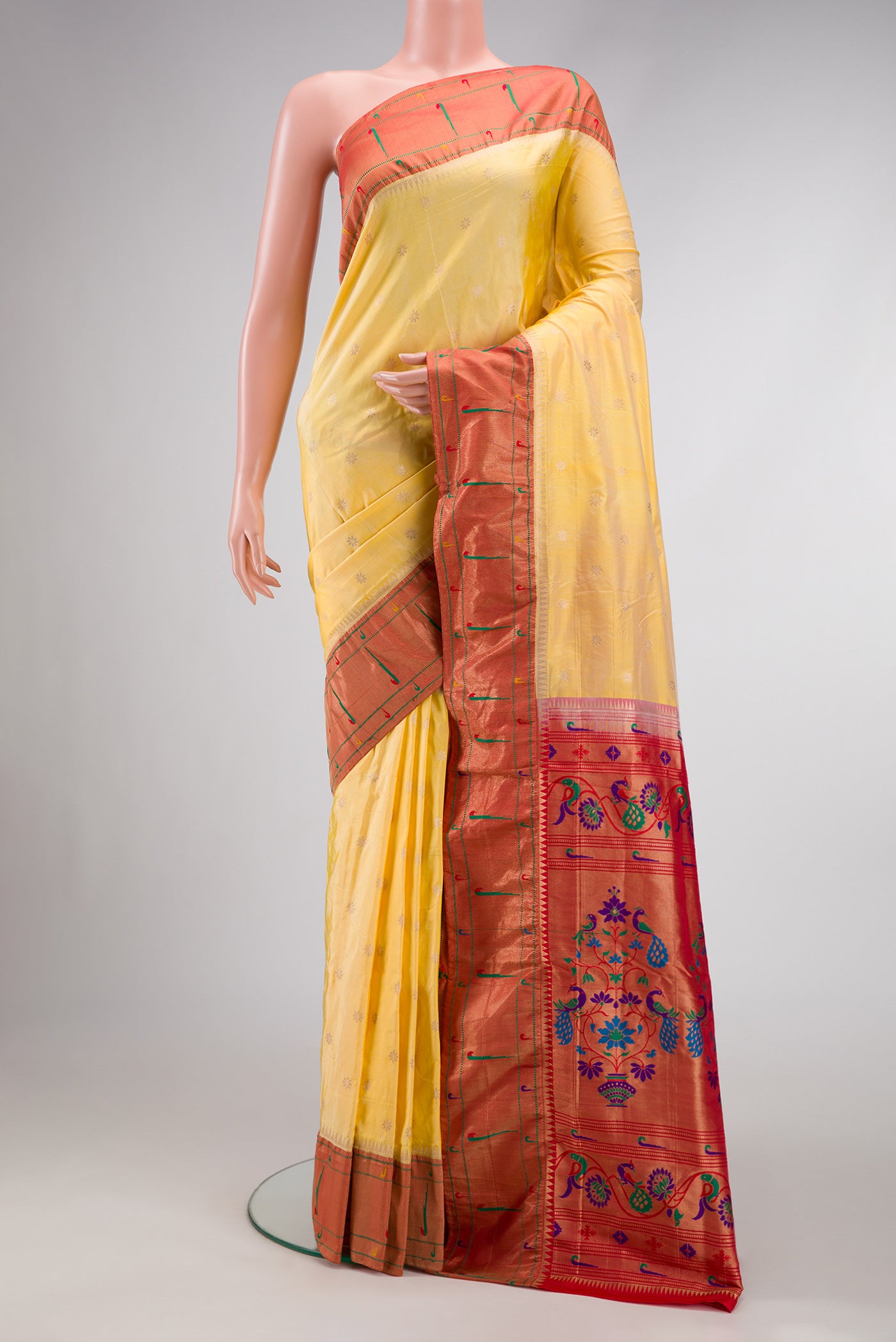 Sandal Dual Tone Paithani Silk Saree with Zari Butta on the body and Paithani Border.  displayed on a mannequin