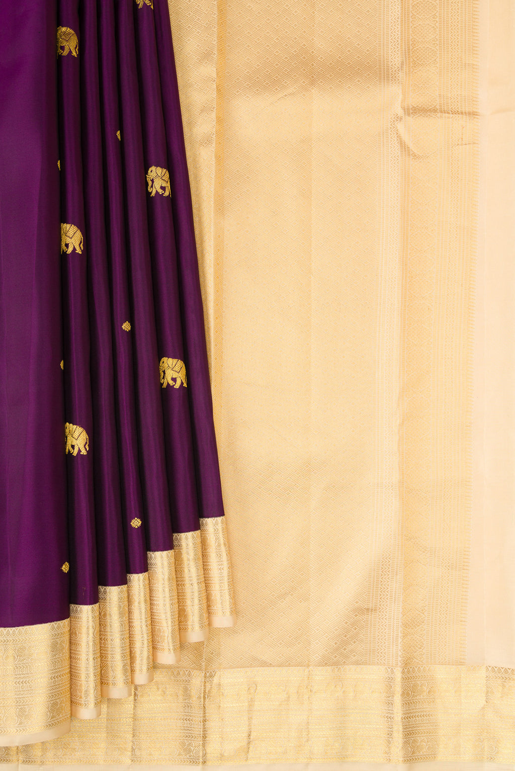 Pleats and pallu of Purple Kanchipuram Silk Saree with Zari Butta on the body and Zari Border. 