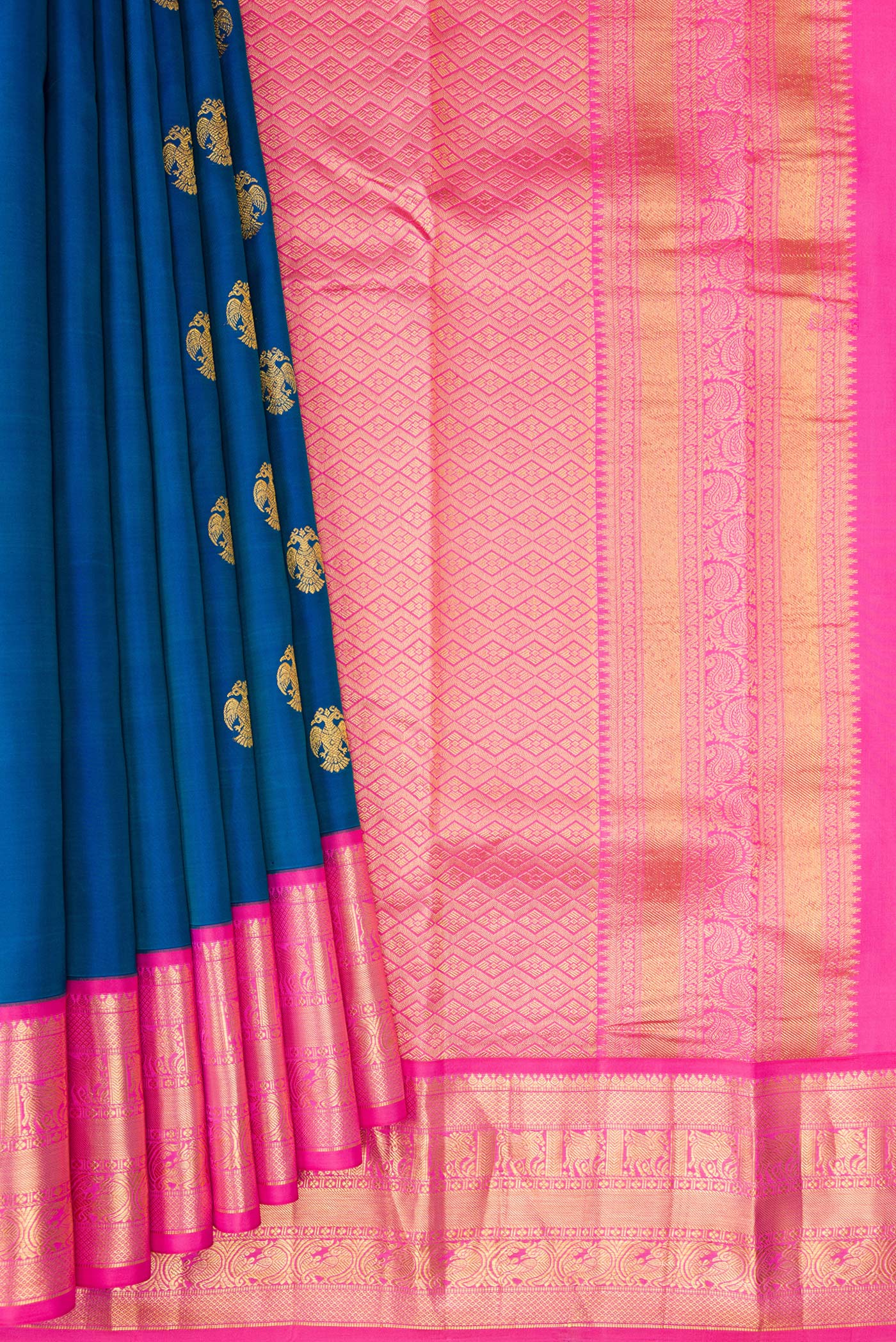 Pleats and pallu of Peacock Blue Kanchipuram Silk Saree with Zari Butta on the body and Zari Border. 
