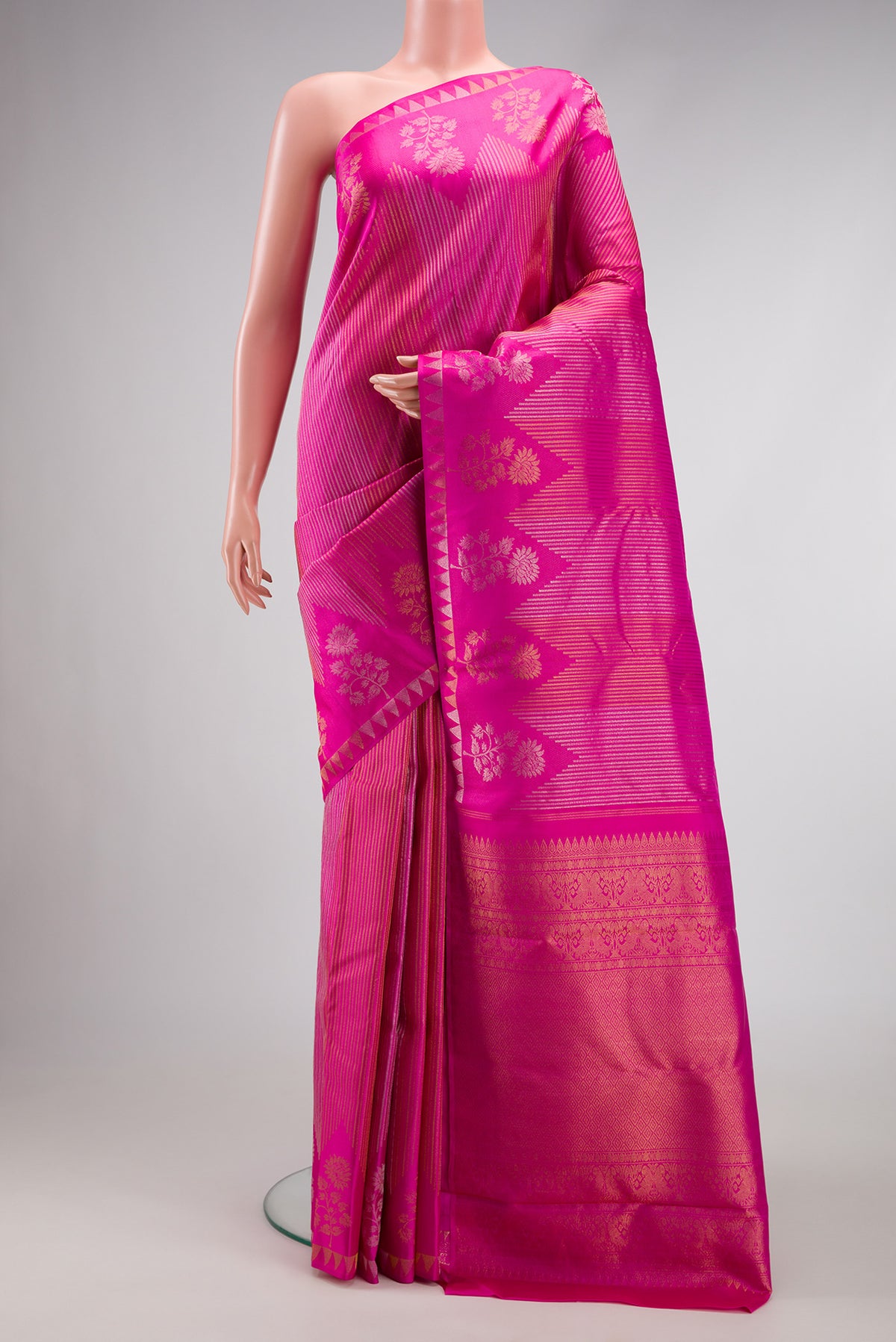 Pink Dual Tone Kanjivaram Silk Saree with Stripes on the body and Fancy Border.  displayed on a mannequin