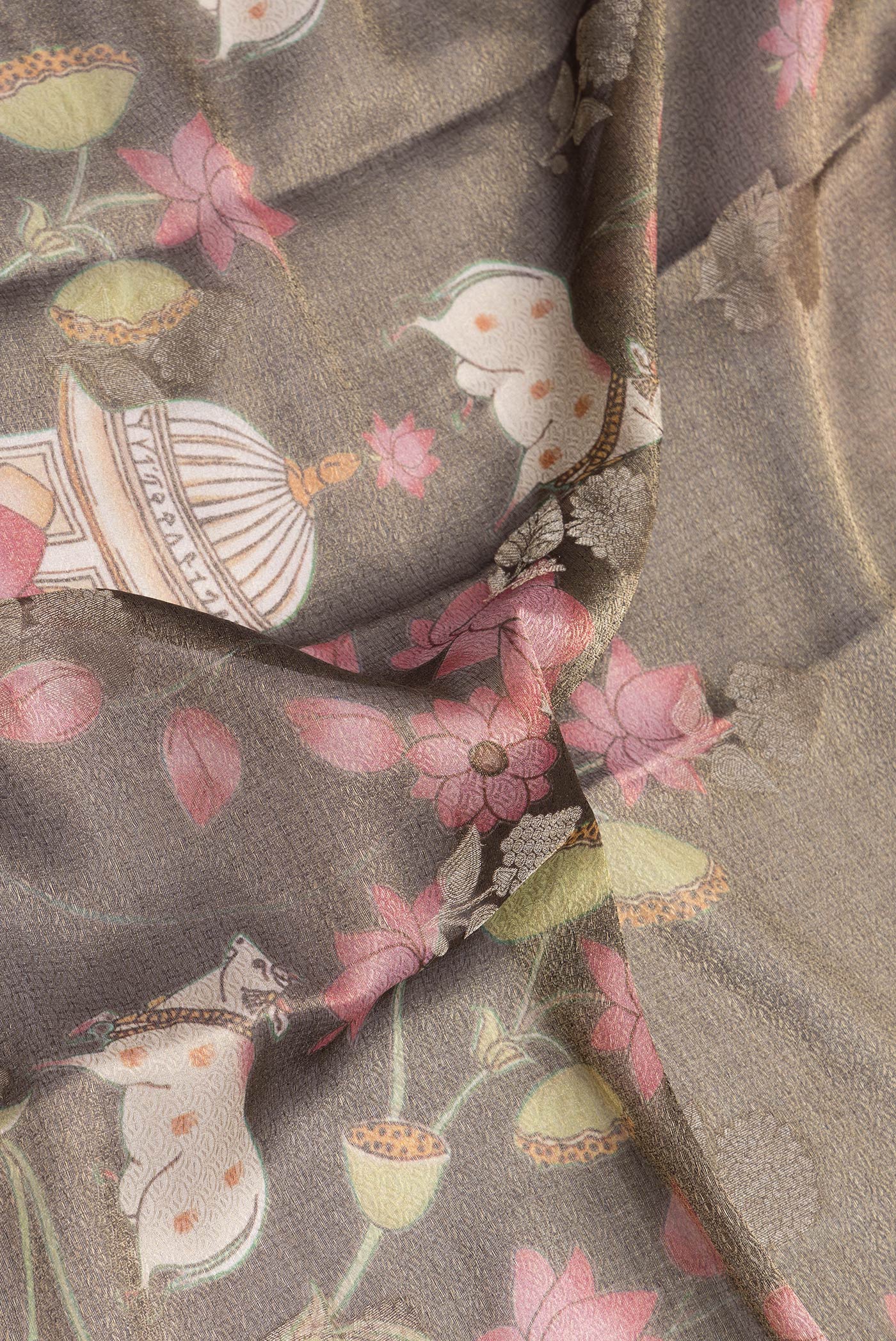 Close up of Brown Dual Tone Mysore Silk Saree with Zari Brocade on the body and Zari Border.  displaying folds