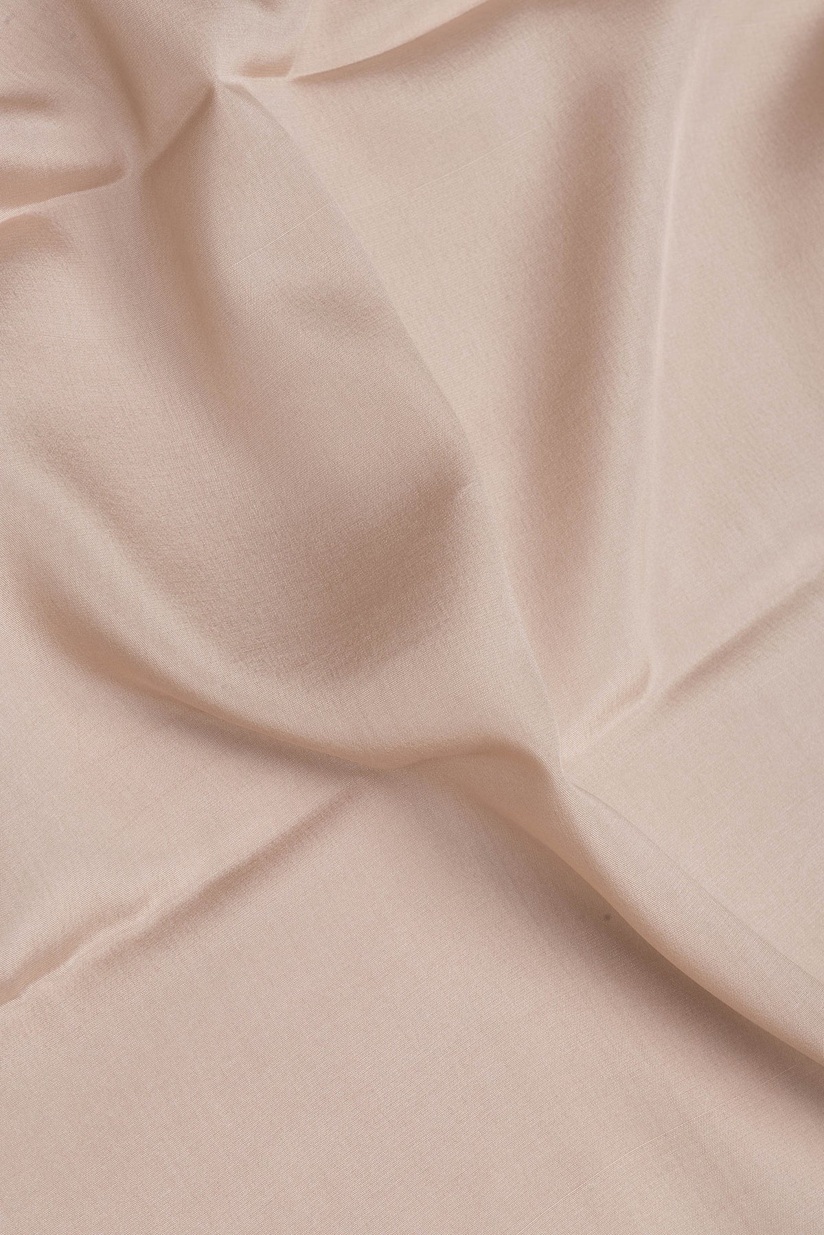 Close up of Beige Mysore Silk Saree with Plain Body and Fancy Border.  displaying folds