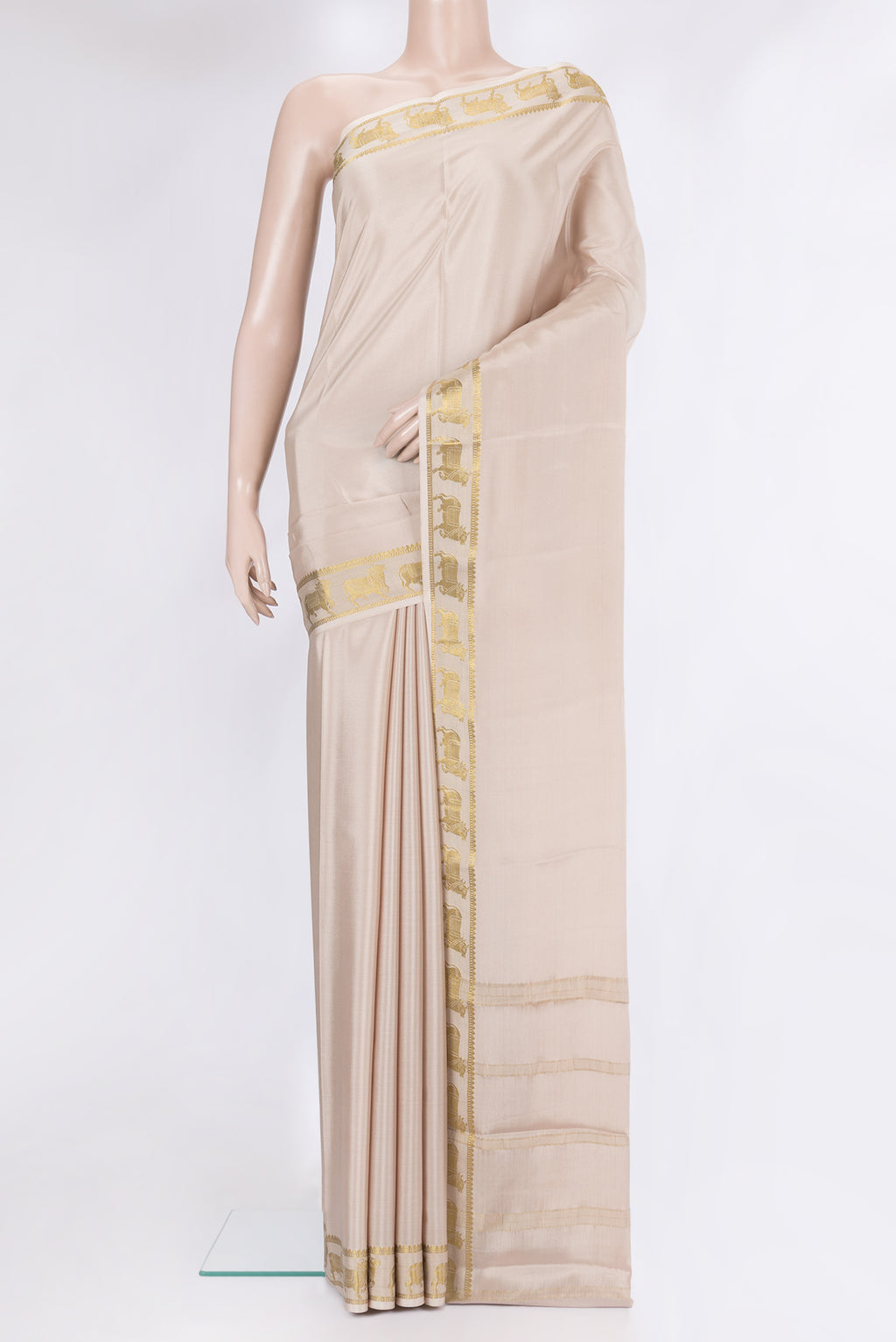 Beige Mysore Silk Saree with Plain Body and Fancy Border.  displayed on a mannequin