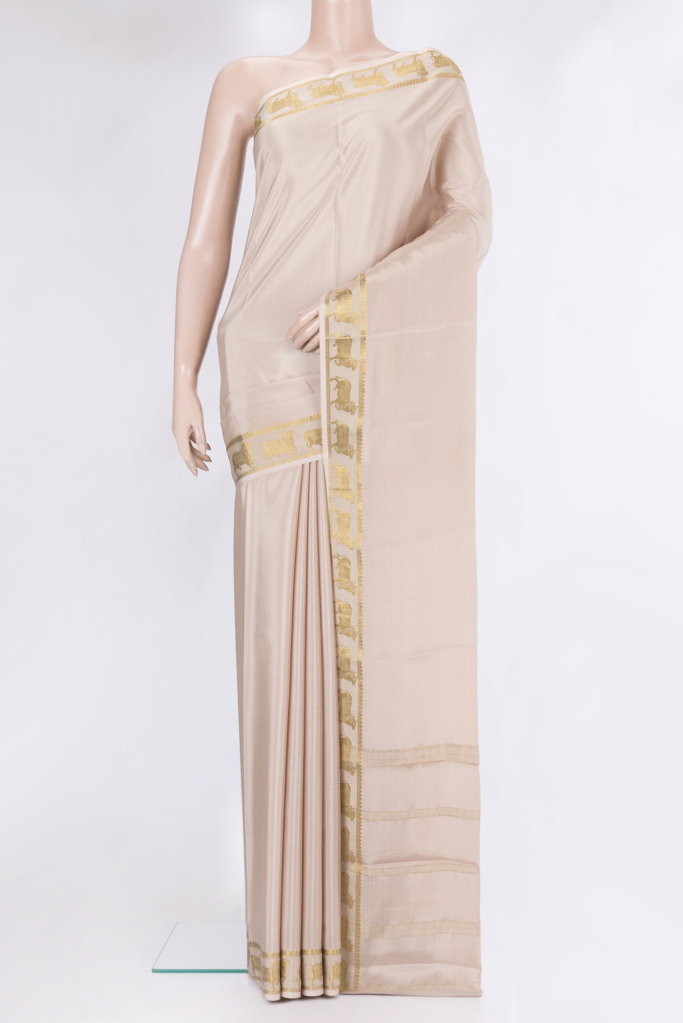 Beige Mysore Silk Saree with Plain Body and Fancy Border.  displayed on a mannequin