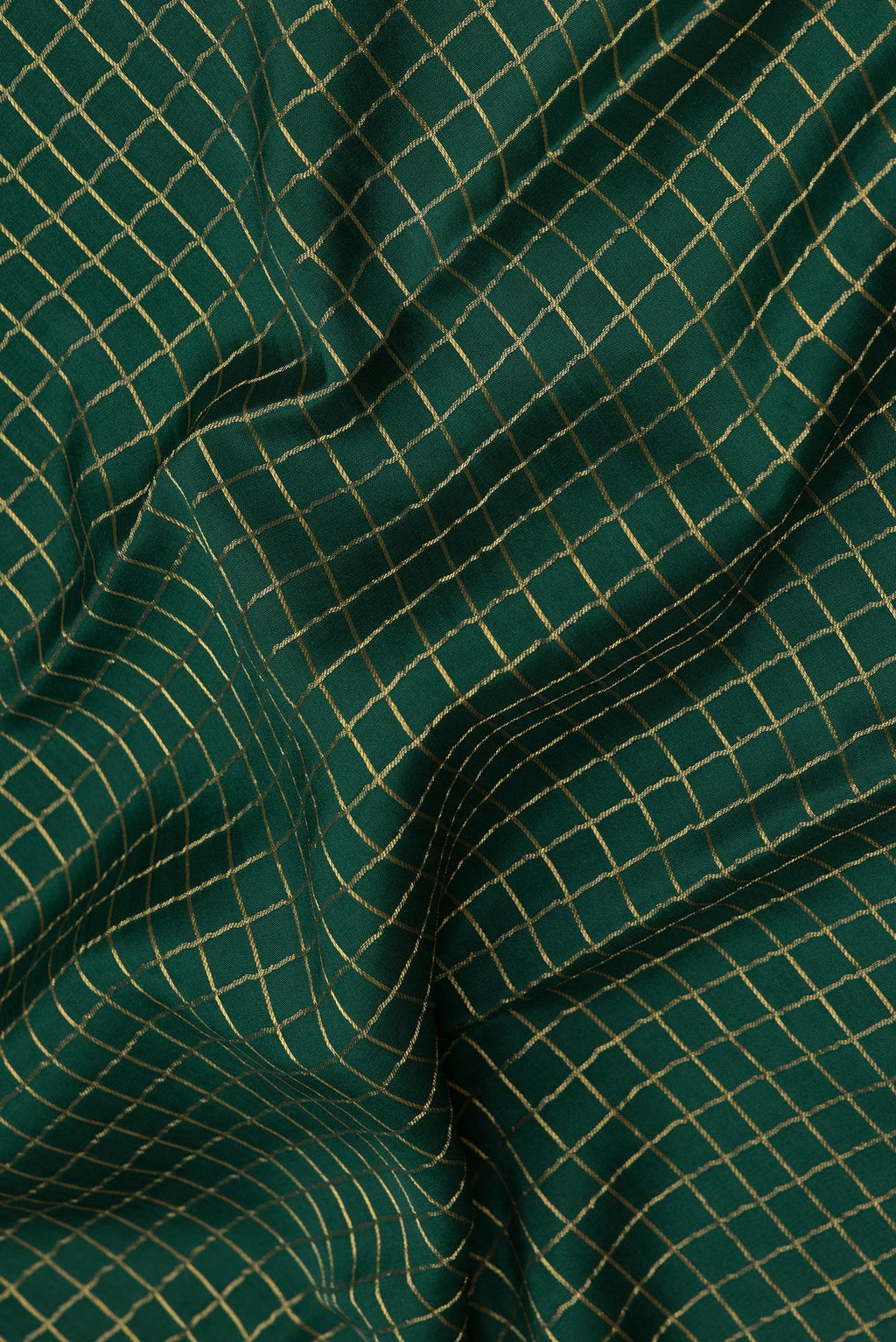 Close up of Bottle Green Mysore Silk Saree with Checked design on the body and Zari Border.  displaying folds