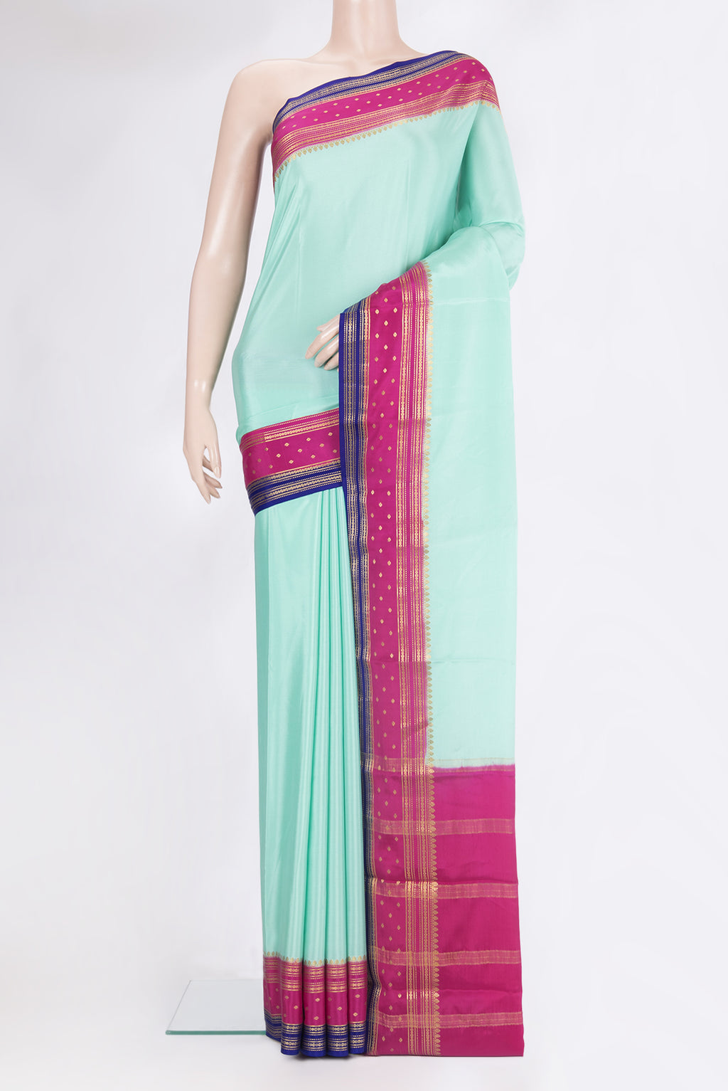 Pure Silk Sky Blue Mysore Silk Saree with Plain Body and Zari Border.  displayed on a mannequin
