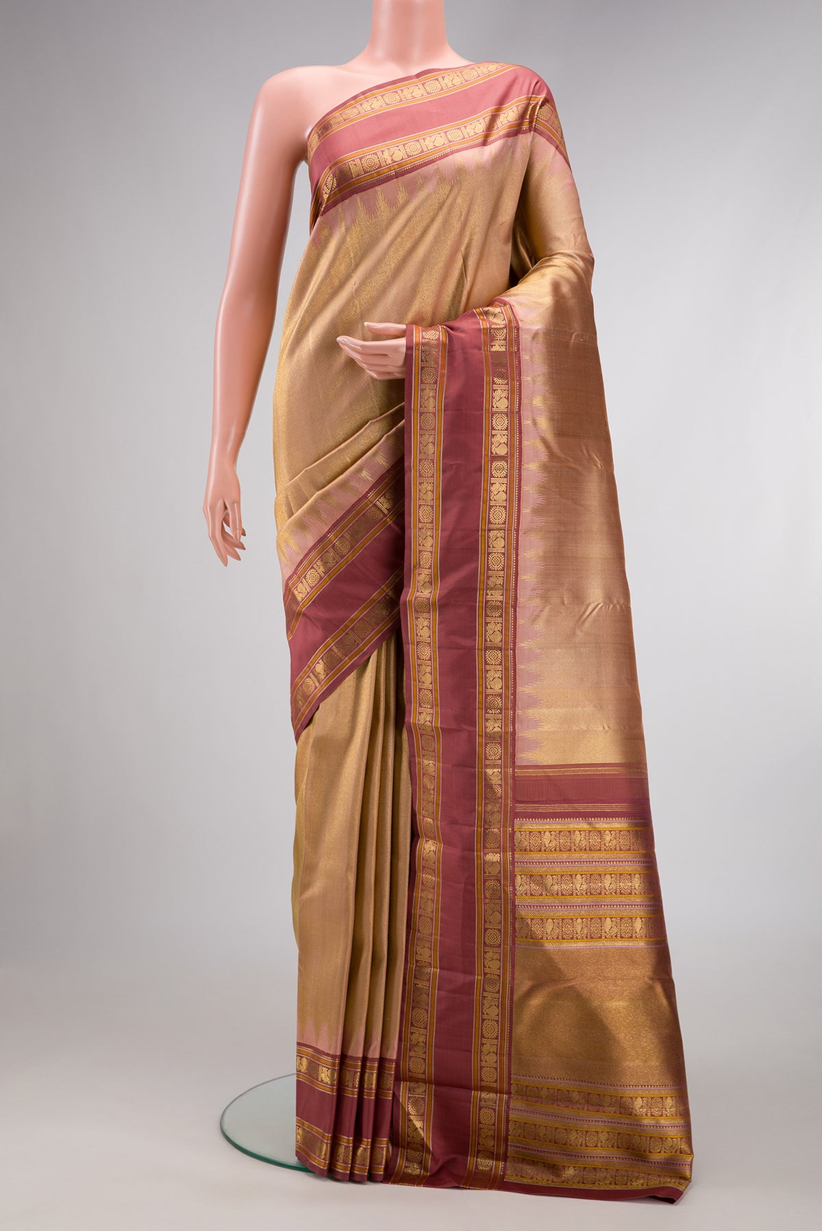 Pure Silk Pure Zari Sandal Dual Tone Kanchipuram Saree with Zari Brocade on the body and Zari Border.  displayed on a mannequin