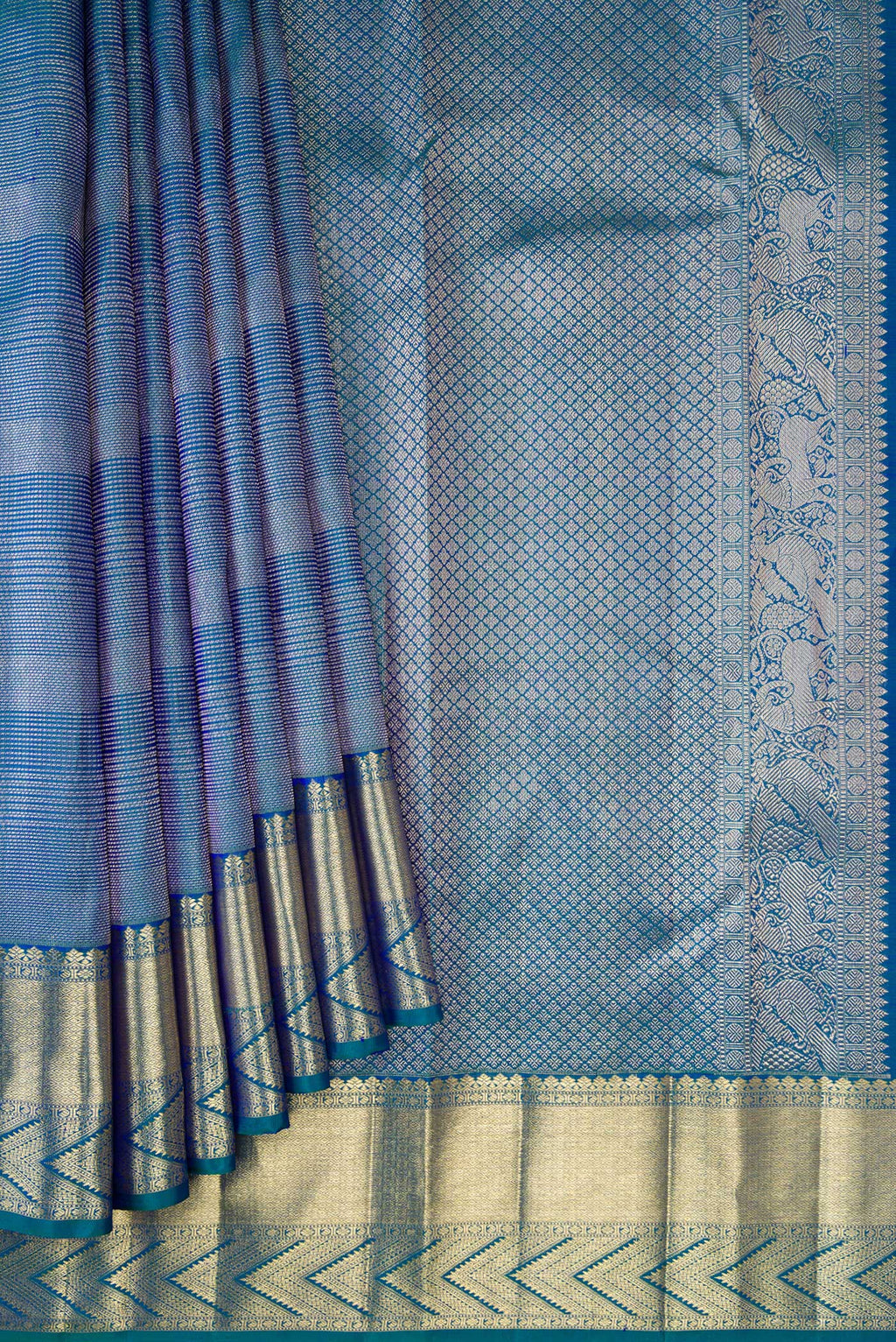 Pleats and pallu of Peacock Blue Dual Tone Kanchipuram Silk Saree with Zari Brocade on the body and Zari Border. 