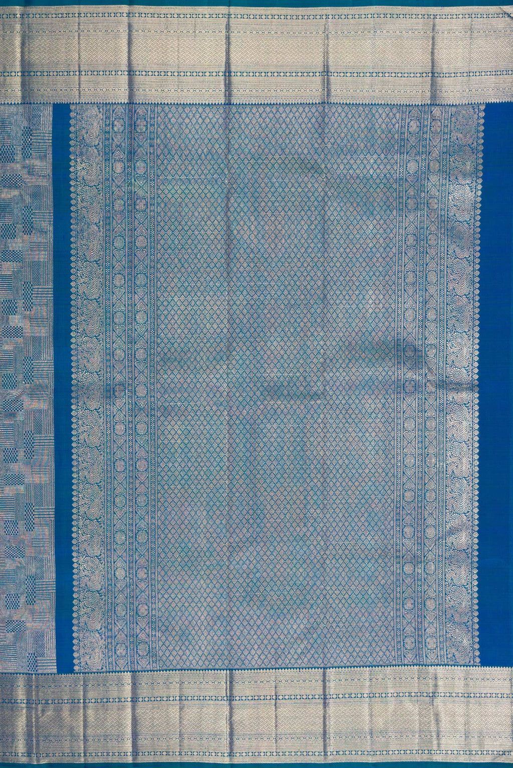 Close up image of the pallu of Peacock Blue Kanchipuram Silk Saree with Zari Brocade on the body and Zari Border. 