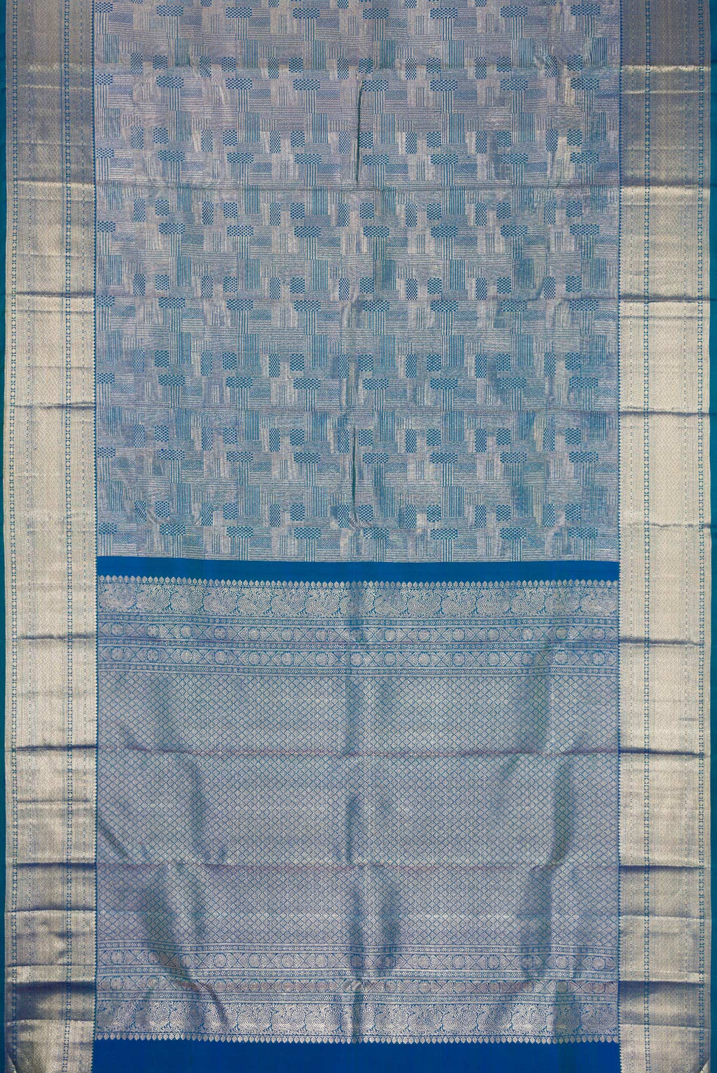 Flat view of Peacock Blue Kanchipuram Silk Saree with Zari Brocade on the body and Zari Border. 
