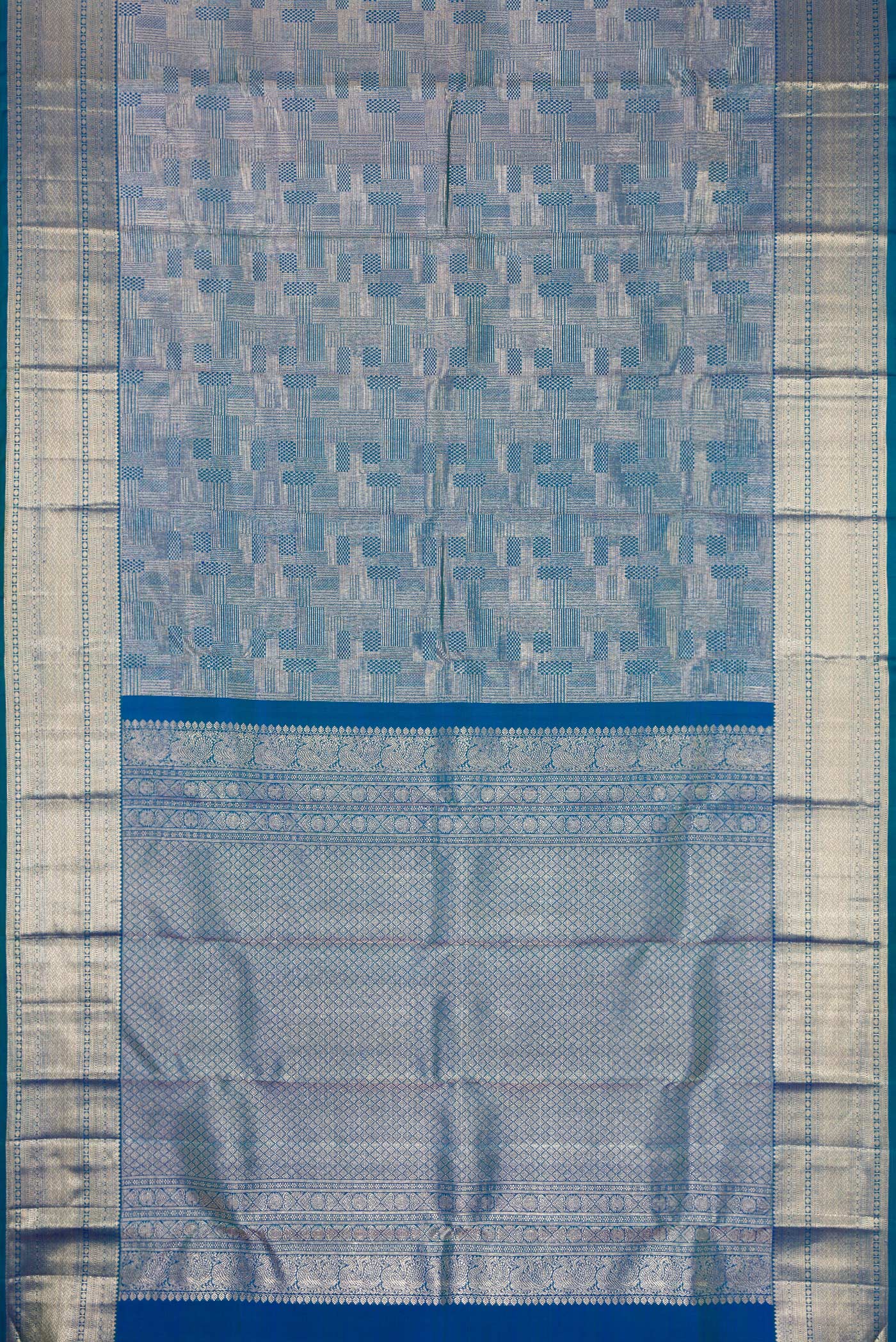 Flat view of Peacock Blue Kanchipuram Silk Saree with Zari Brocade on the body and Zari Border. 