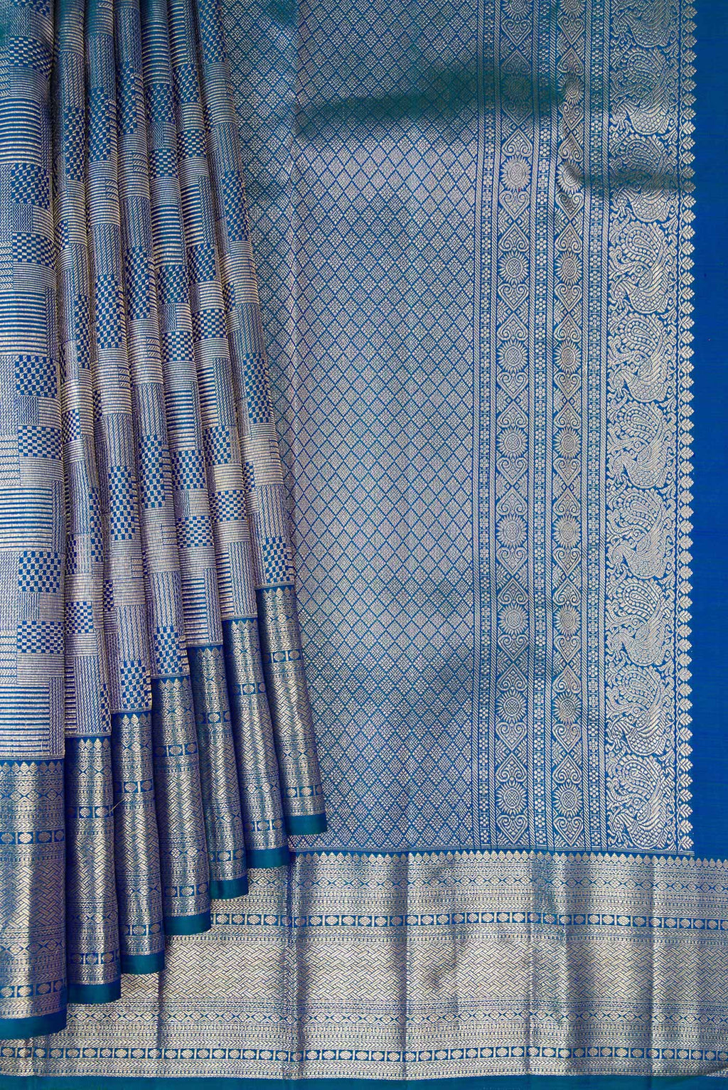 Pleats and pallu of Peacock Blue Kanchipuram Silk Saree with Zari Brocade on the body and Zari Border. 