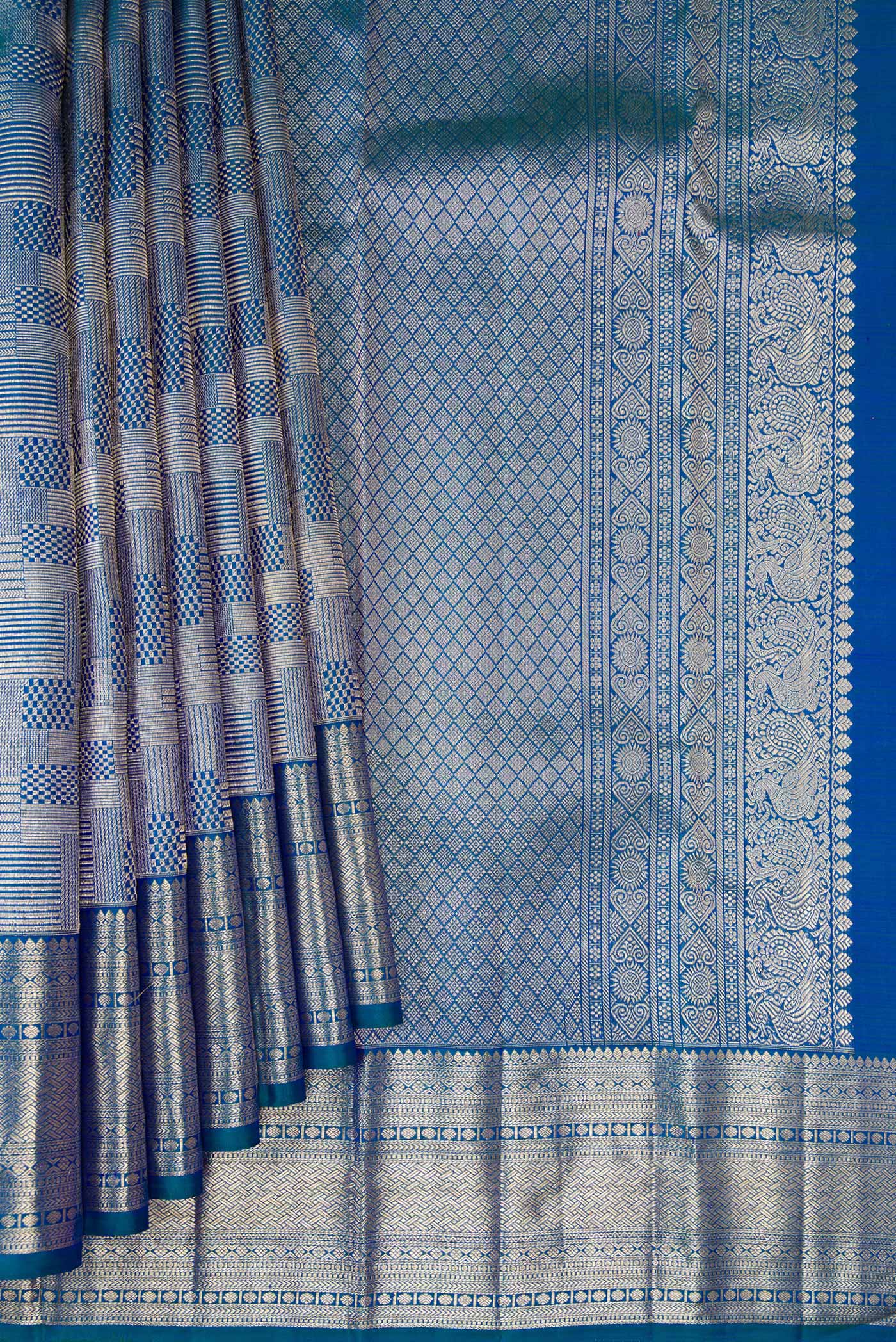 Pleats and pallu of Peacock Blue Kanchipuram Silk Saree with Zari Brocade on the body and Zari Border. 