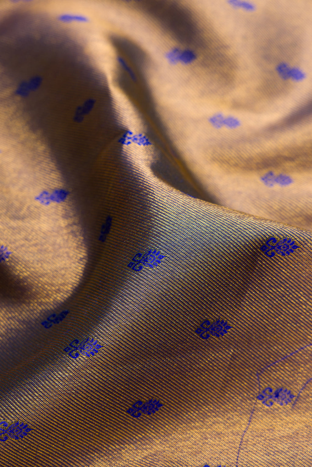 Close up of Peacock Blue Kanjivaram Silk Saree with Zari Brocade on the body and Zari Border.  displaying folds