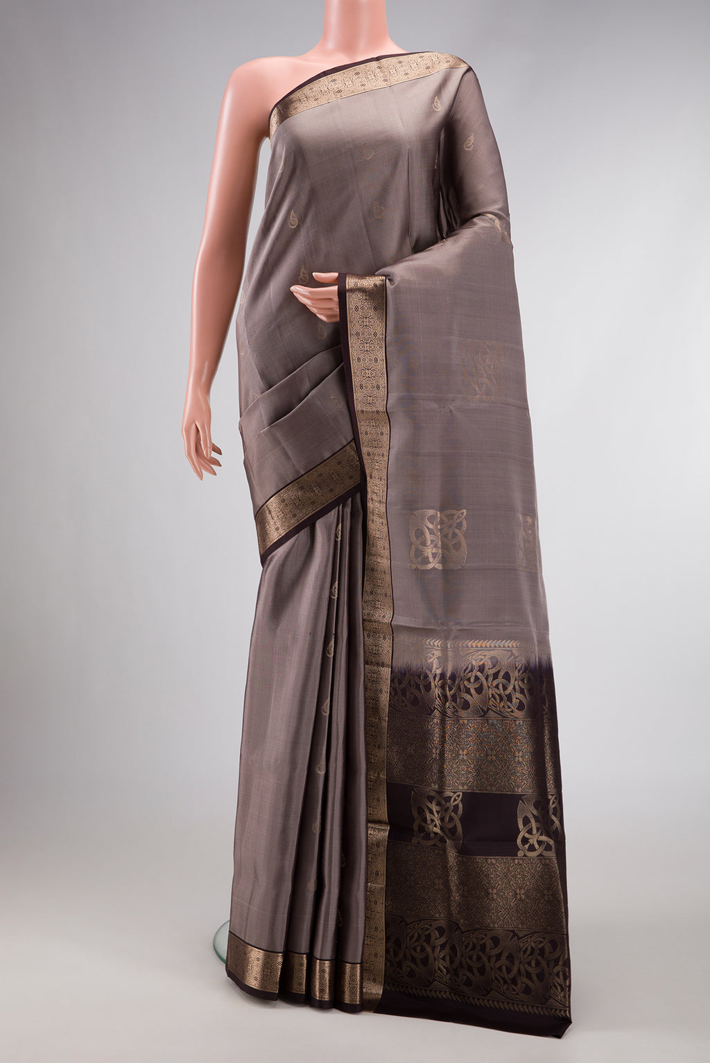 Grey Dual Tone Soft Silk Saree with Zari Butta on the body and Zari Border.  displayed on a mannequin