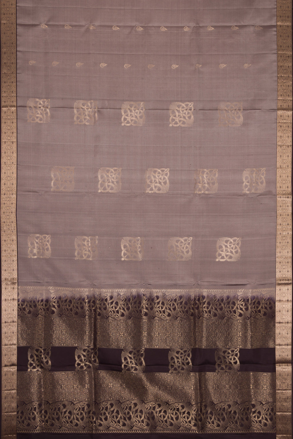 Flat view of Grey Dual Tone Soft Silk Saree with Zari Butta on the body and Zari Border. 