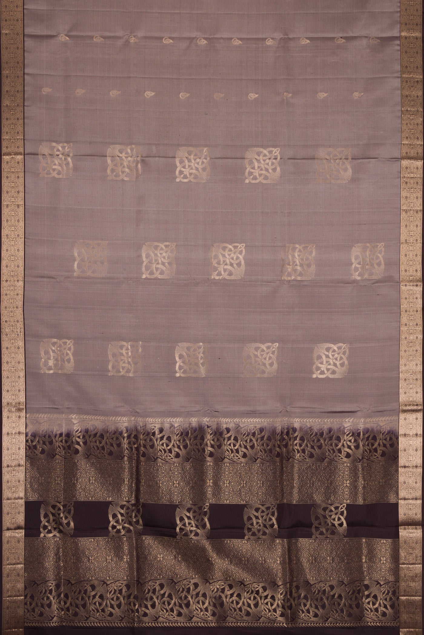 Flat view of Grey Dual Tone Soft Silk Saree with Zari Butta on the body and Zari Border. 