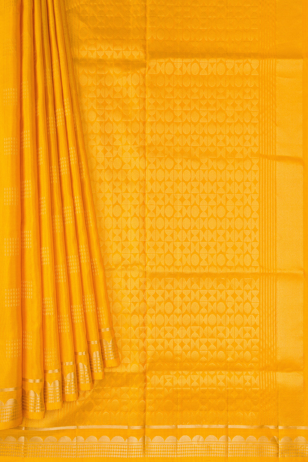 Pleats and pallu of Mustard Dual Tone Soft Silk Saree with Zari Butta on the body and Zari Border. 