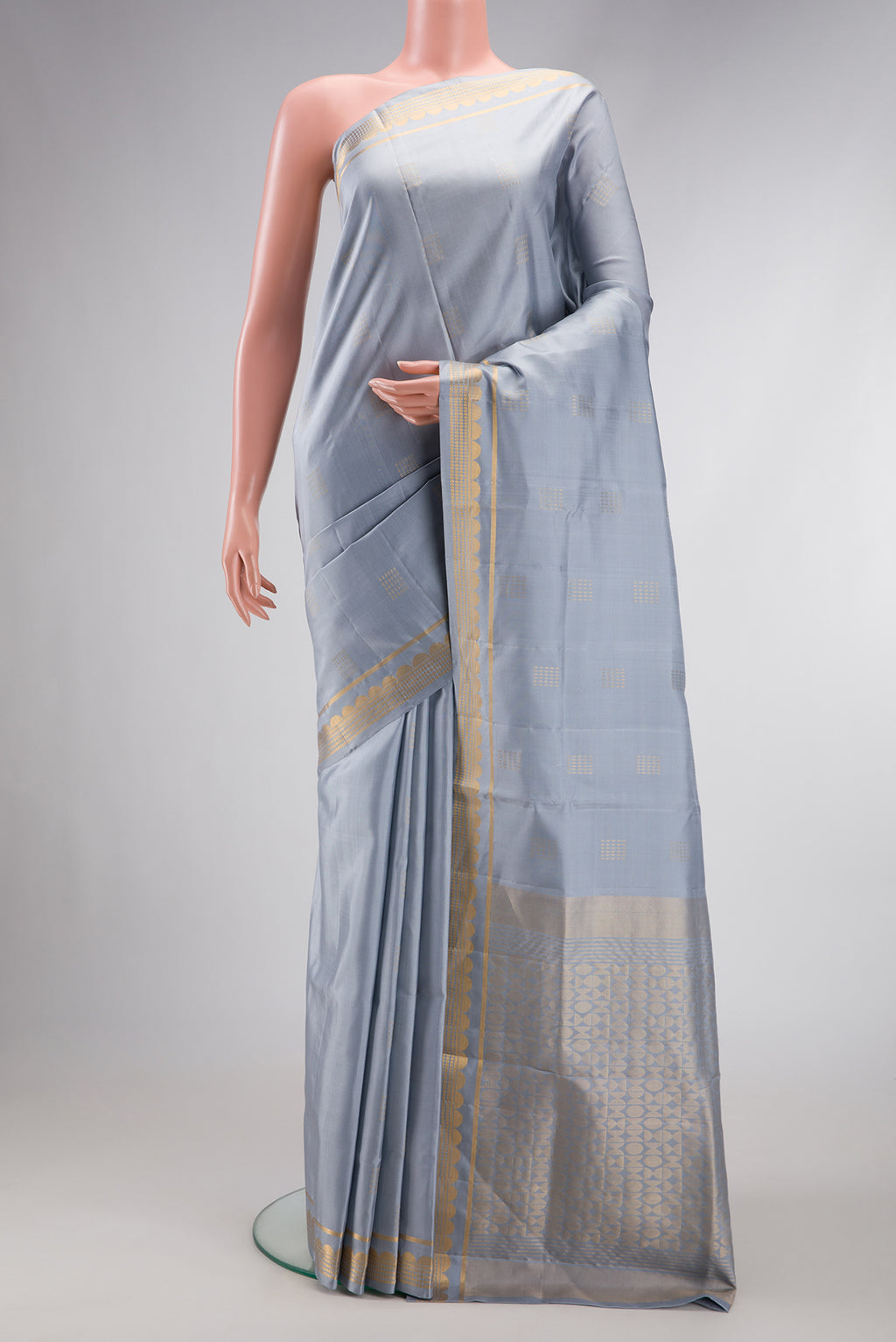 Grey Dual Tone Soft Silk Saree with Zari Butta on the body and Zari Border.  displayed on a mannequin
