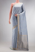 Grey Dual Tone Soft Silk Saree with Zari Butta on the body and Zari Border.  displayed on a mannequin