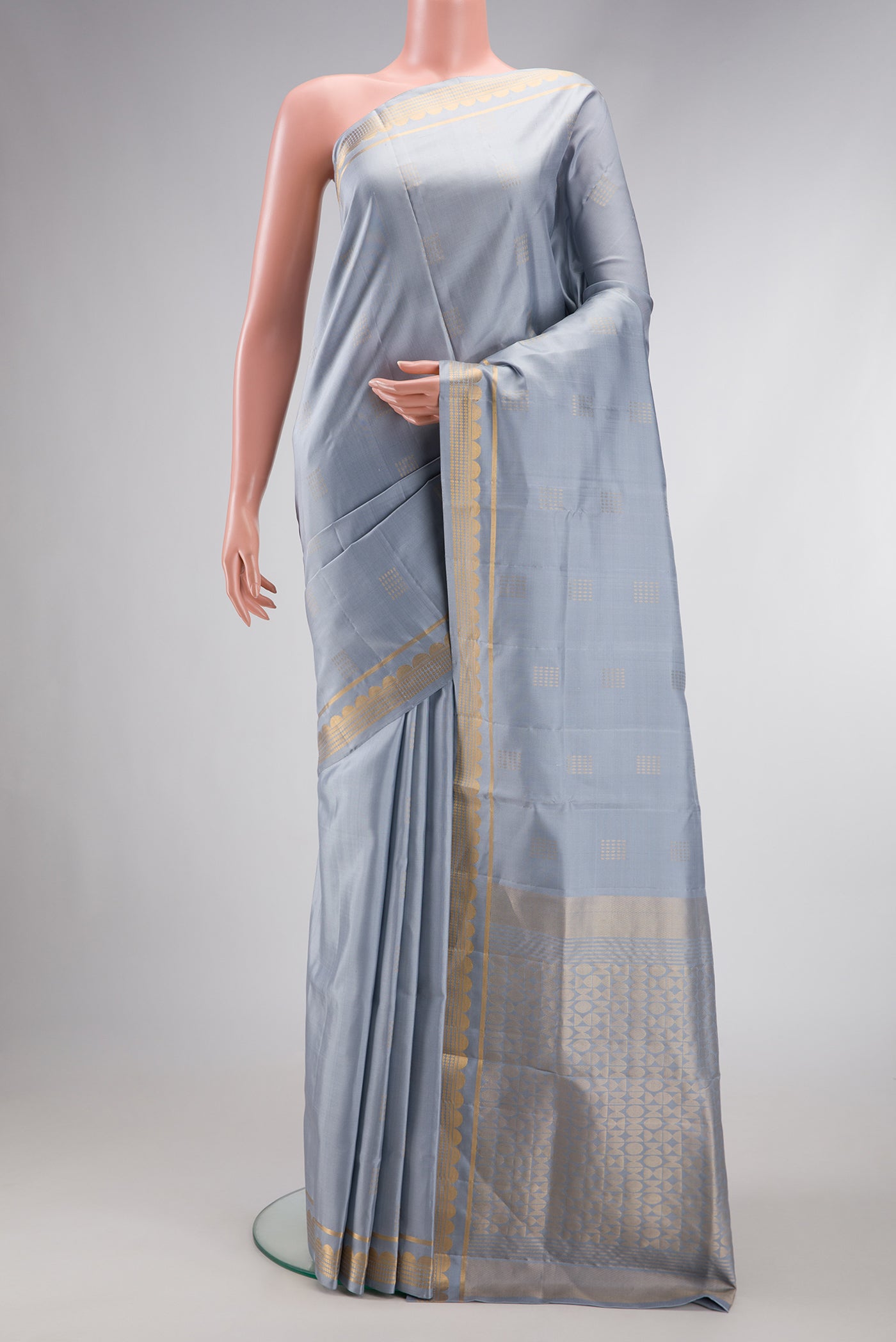 Grey Dual Tone Soft Silk Saree with Zari Butta on the body and Zari Border.  displayed on a mannequin