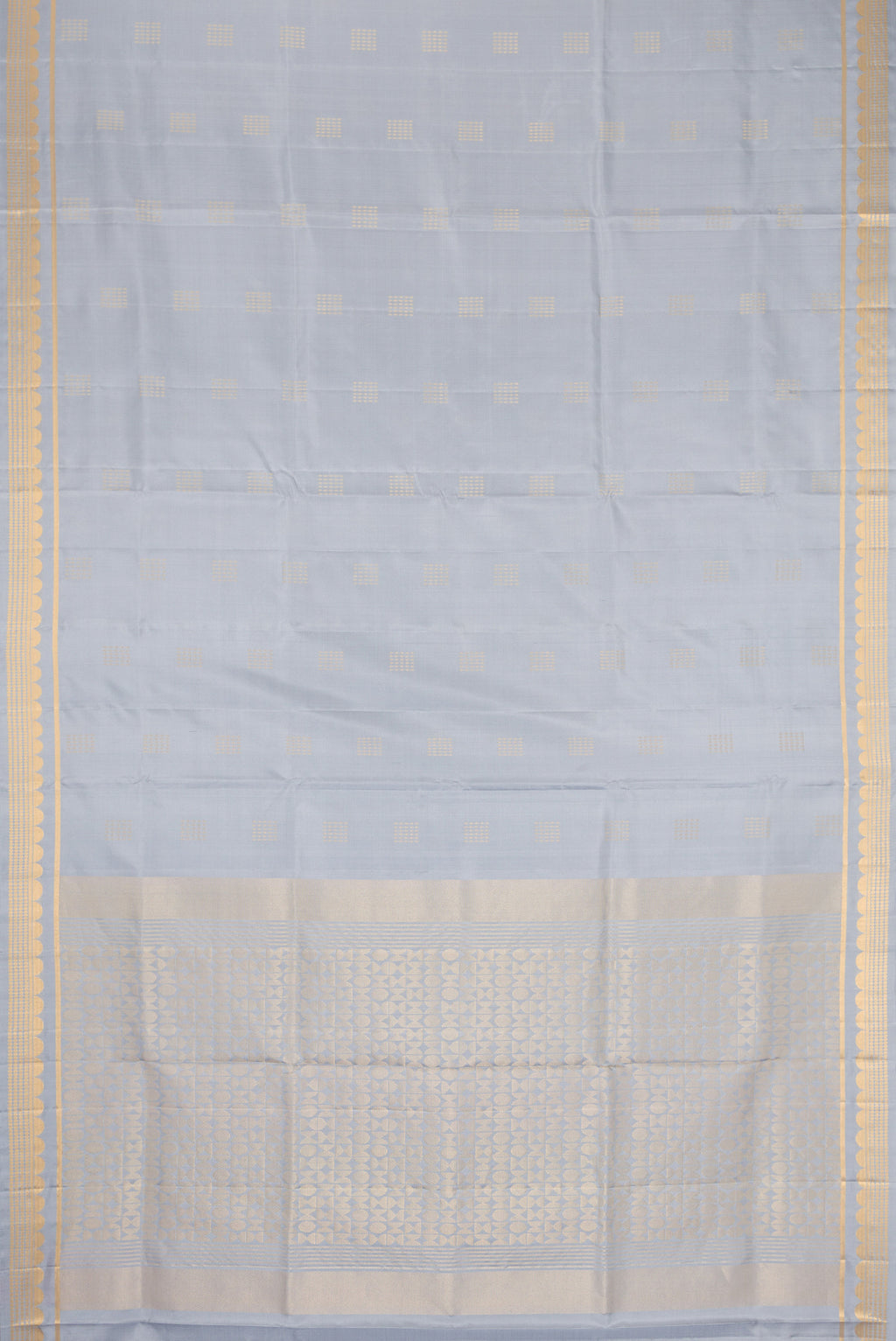 Flat view of Grey Dual Tone Soft Silk Saree with Zari Butta on the body and Zari Border. 