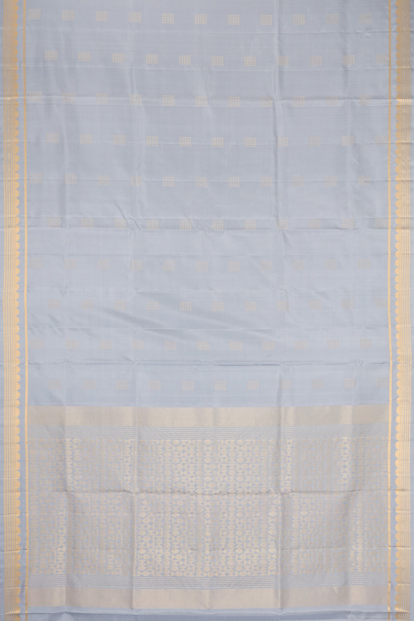 Flat view of Grey Dual Tone Soft Silk Saree with Zari Butta on the body and Zari Border. 