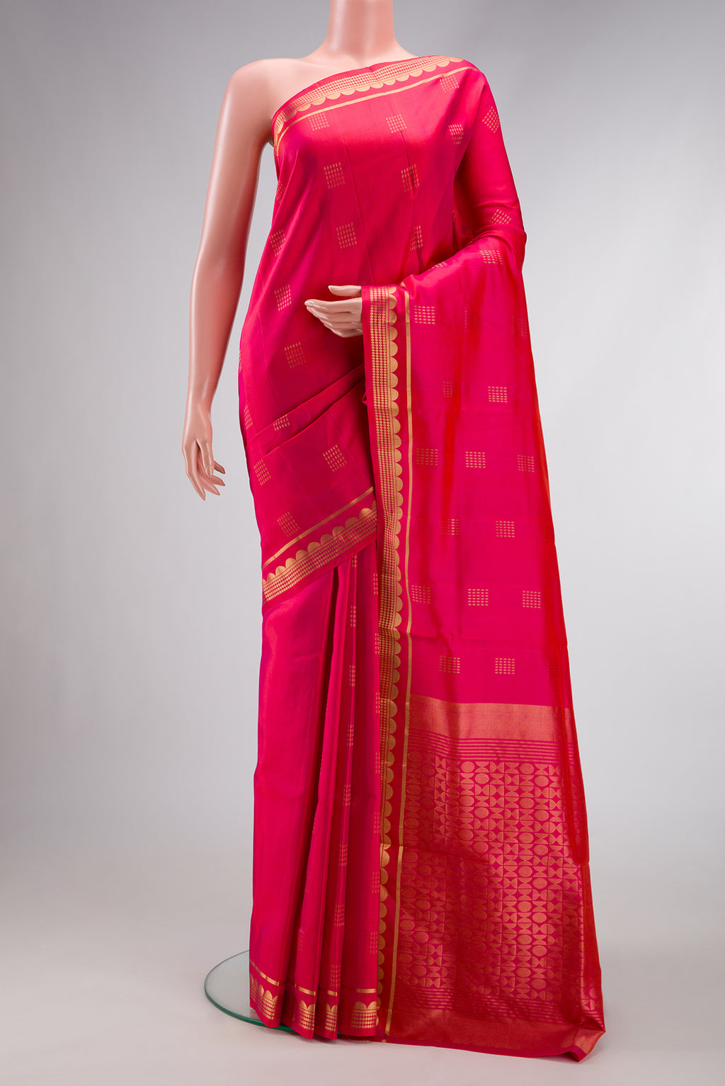 Coral Dual Tone Soft Silk Saree with Zari Butta on the body and Zari Border.  displayed on a mannequin