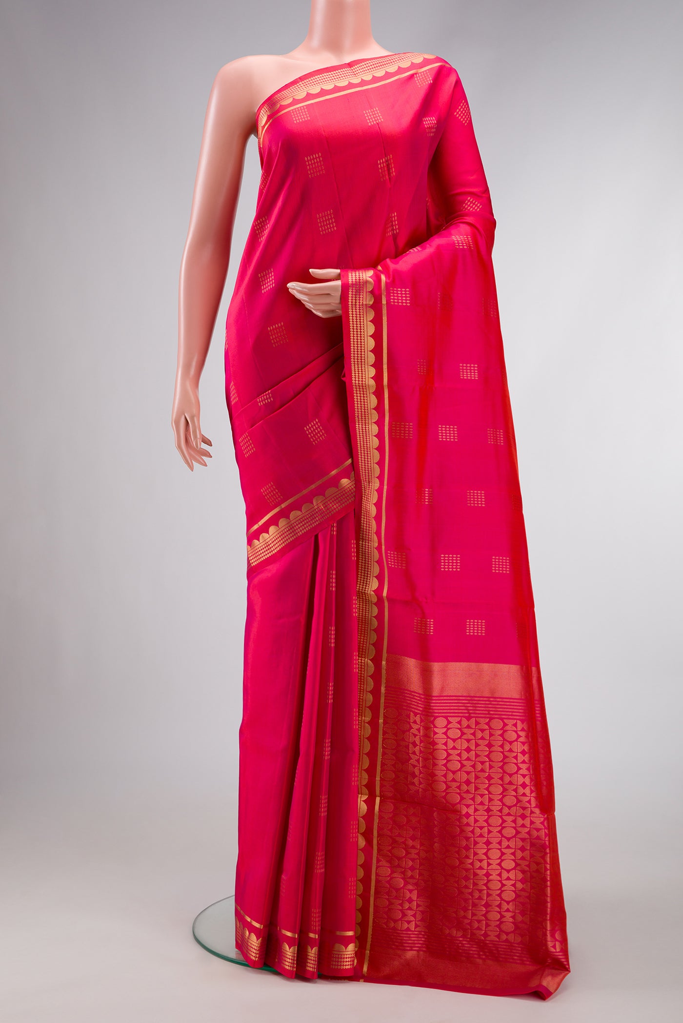 Coral Dual Tone Soft Silk Saree with Zari Butta on the body and Zari Border.  displayed on a mannequin