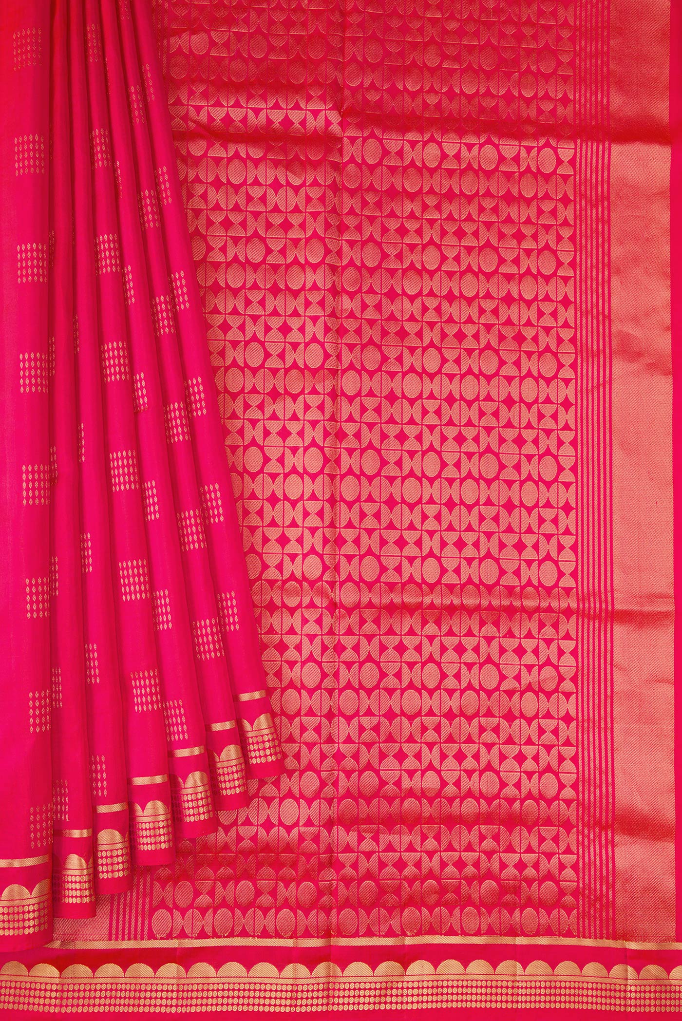 Pleats and pallu of Coral Dual Tone Soft Silk Saree with Zari Butta on the body and Zari Border. 
