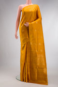 Mustard Dual Tone Soft Silk Saree with Zari Butta on the body and Without Border.  displayed on a mannequin