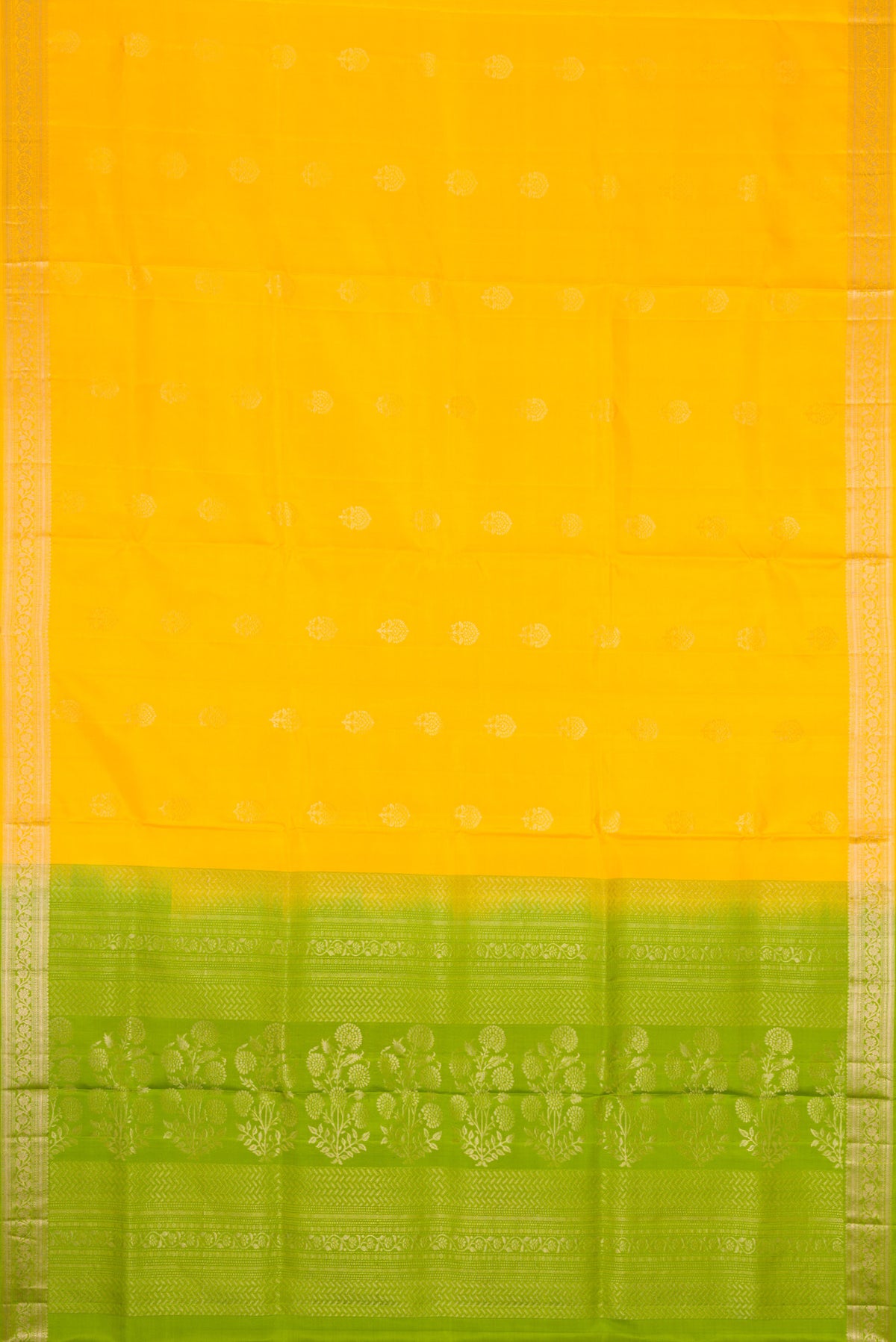 Flat view of Yellow Dual Tone Soft Silk Saree with Zari Butta on the body and Zari Border. 