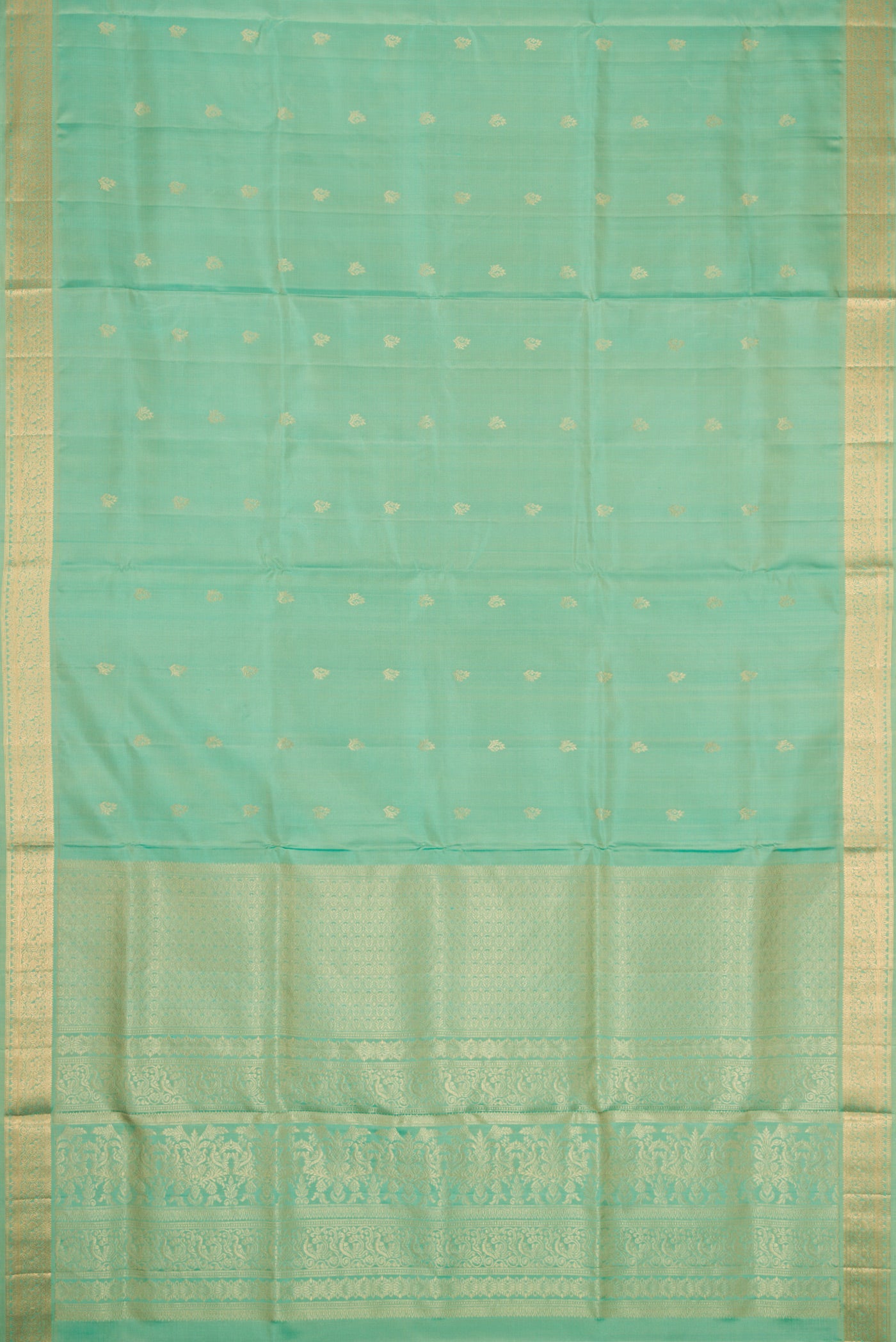 Flat view of Pista Green Dual Tone Soft Silk Saree with Zari Butta on the body and Zari Border. 