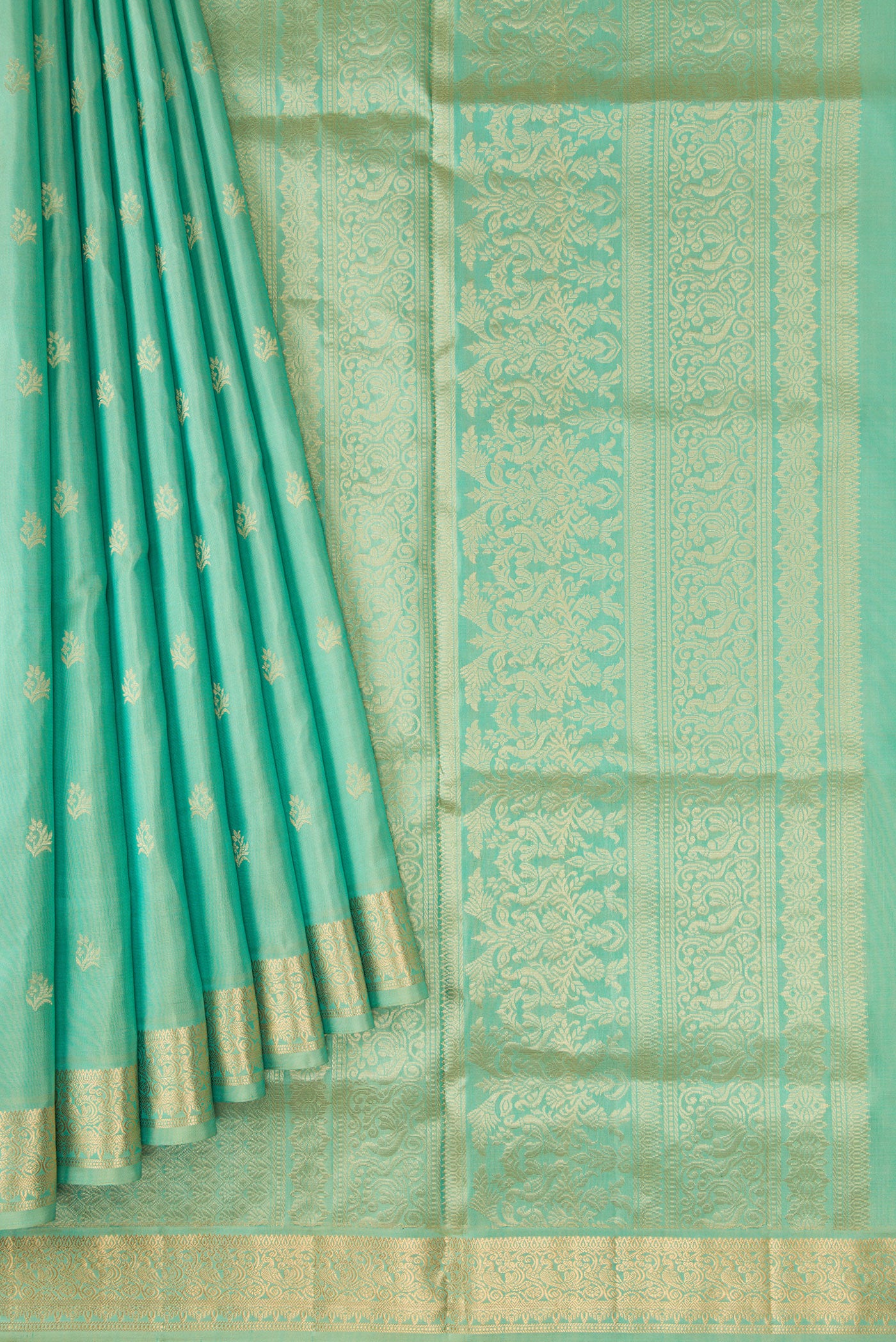 Pleats and pallu of Pista Green Dual Tone Soft Silk Saree with Zari Butta on the body and Zari Border. 