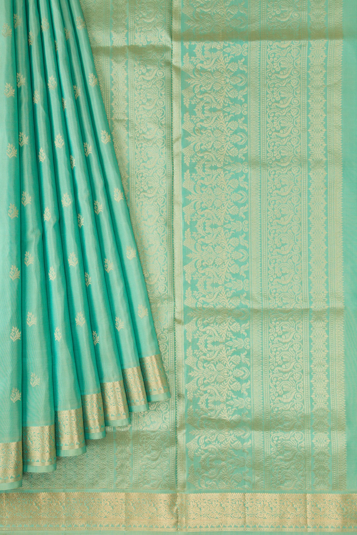 Pleats and pallu of Pista Green Dual Tone Soft Silk Saree with Zari Butta on the body and Zari Border. 
