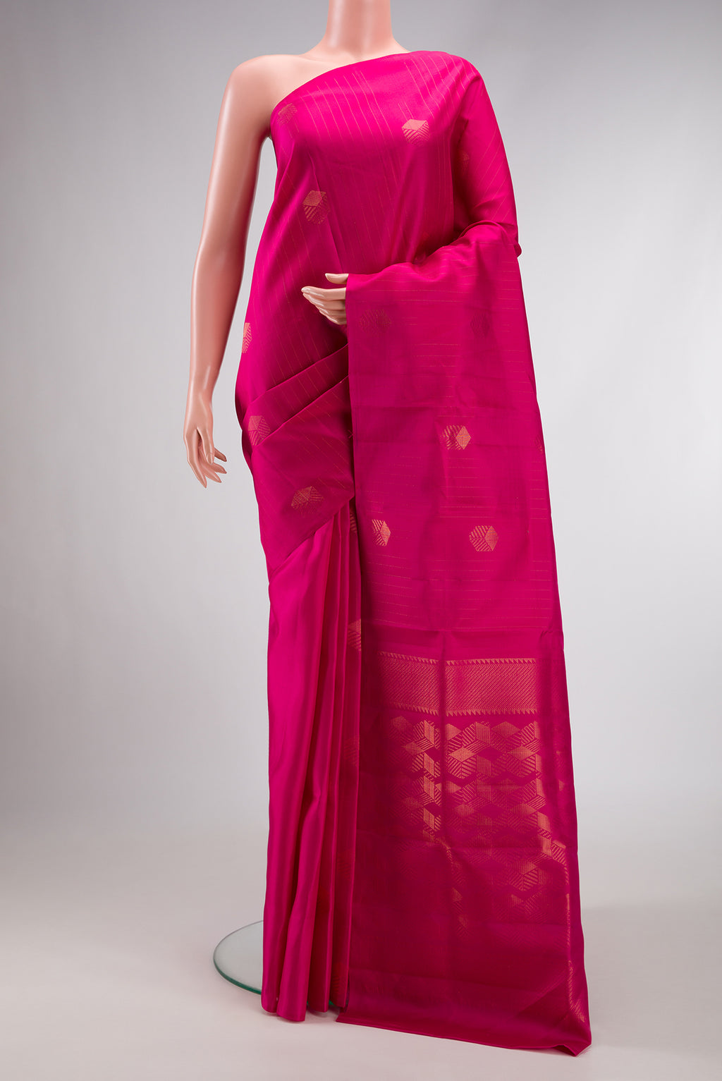 Pure Silk Pure Zari Dark Pink Dual Tone Kanjivaram Saree with Zari Butta on the body and Zari Border.  displayed on a mannequin