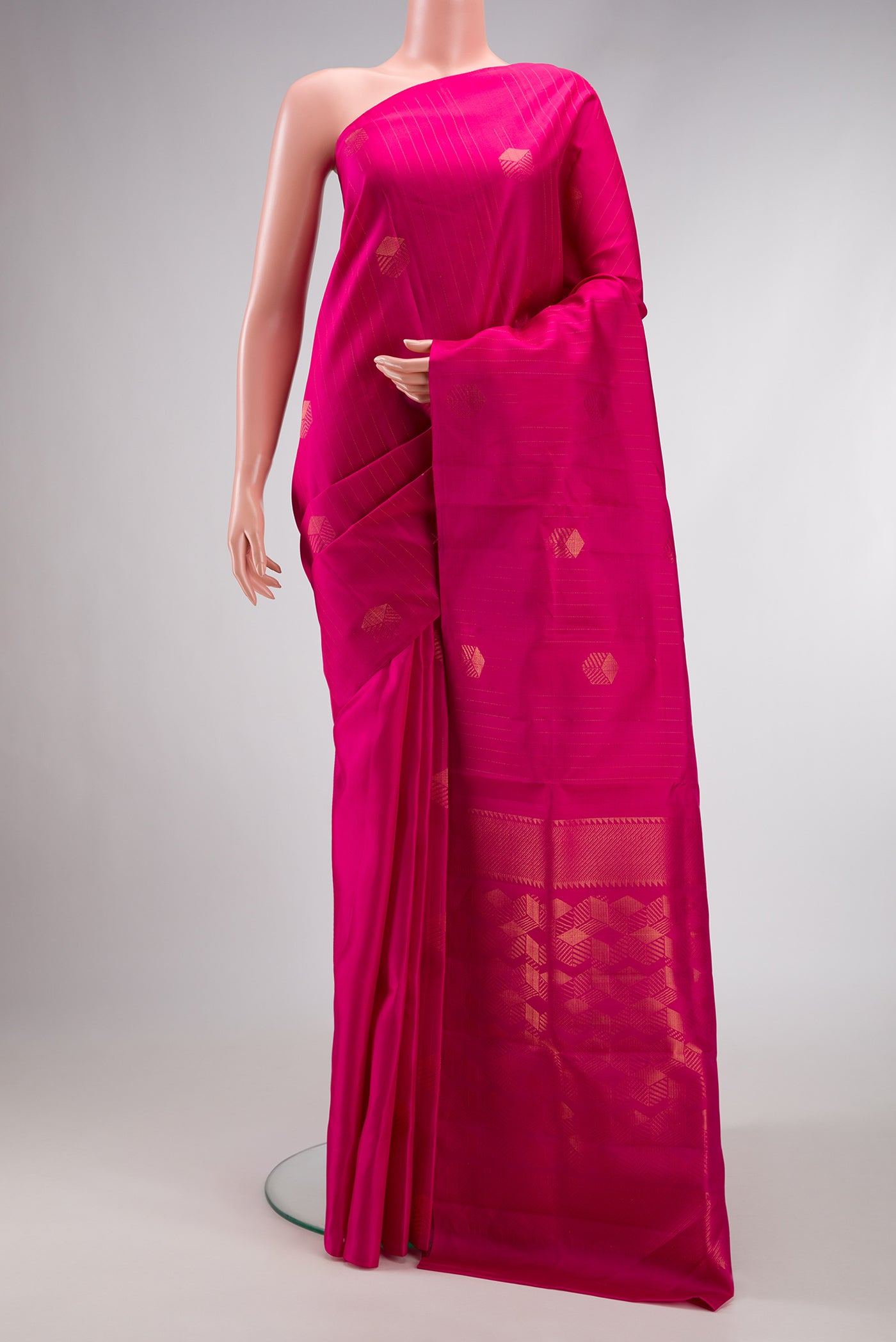 Pure Silk Pure Zari Dark Pink Dual Tone Kanjivaram Saree with Zari Butta on the body and Zari Border.  displayed on a mannequin