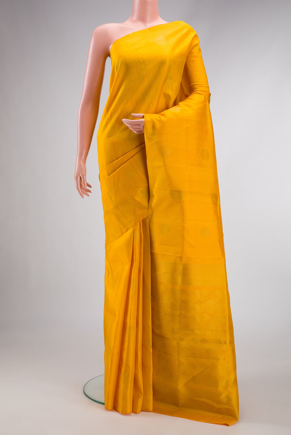 Yellow Dual Tone Soft Silk Saree with Zari Butta on the body and Without Border.  displayed on a mannequin
