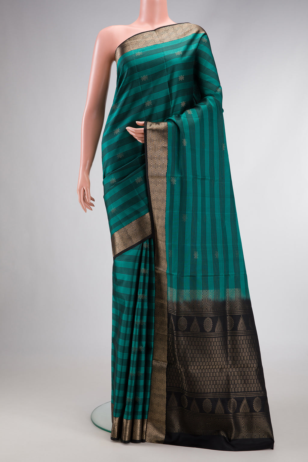 Maya Blue Dual Tone Soft Silk Saree with Zari Butta on the body and Zari Border.  displayed on a mannequin