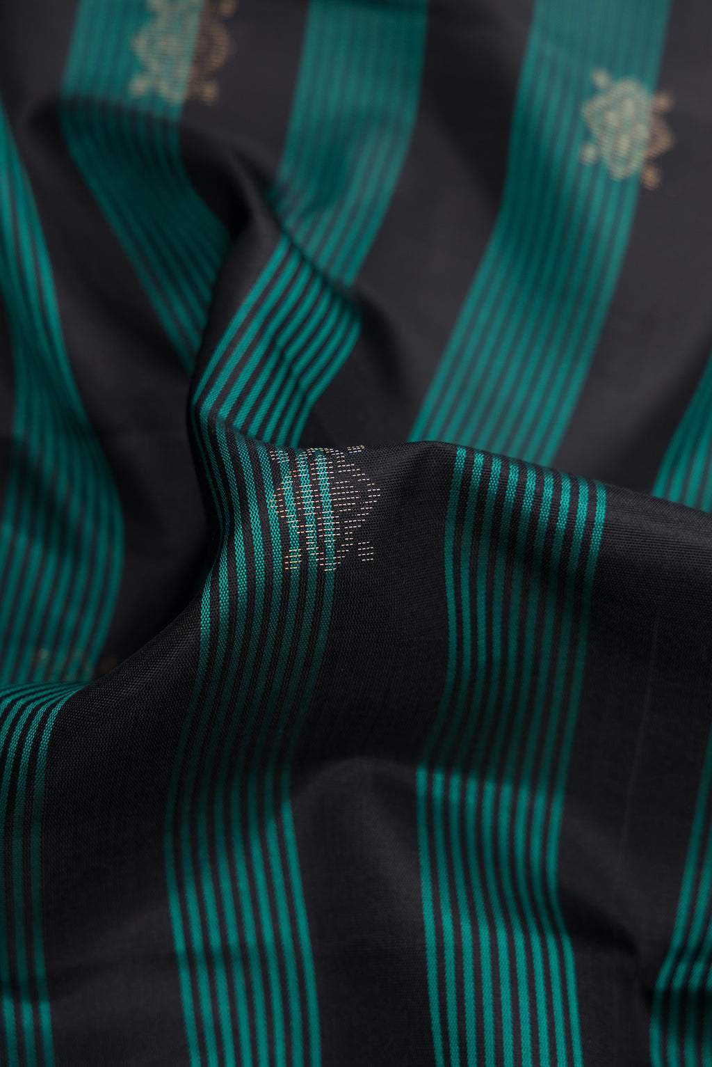 Close up of Maya Blue Dual Tone Soft Silk Saree with Stripes on the body and Zari Border.  displaying folds